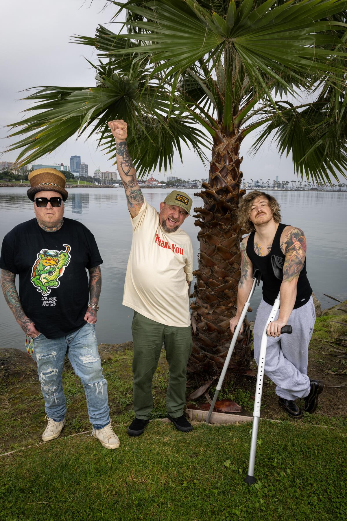  Sublime members stand in front of a palm tree