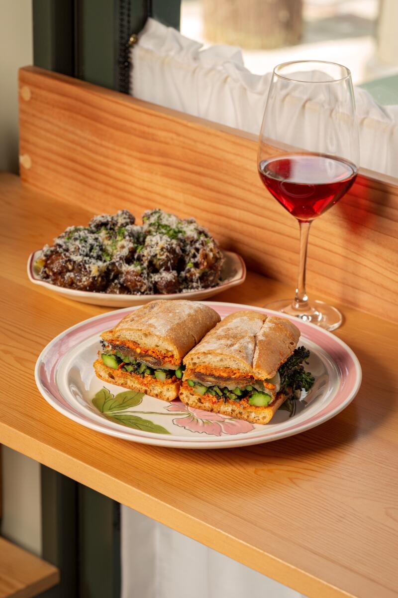 The broccolini panini with a side of Henrietta potatoes (smashed and fried and tossed in garlic aioli and Parmesan cheese). The sandwich is a daytime offering at the Echo Park restaurant.