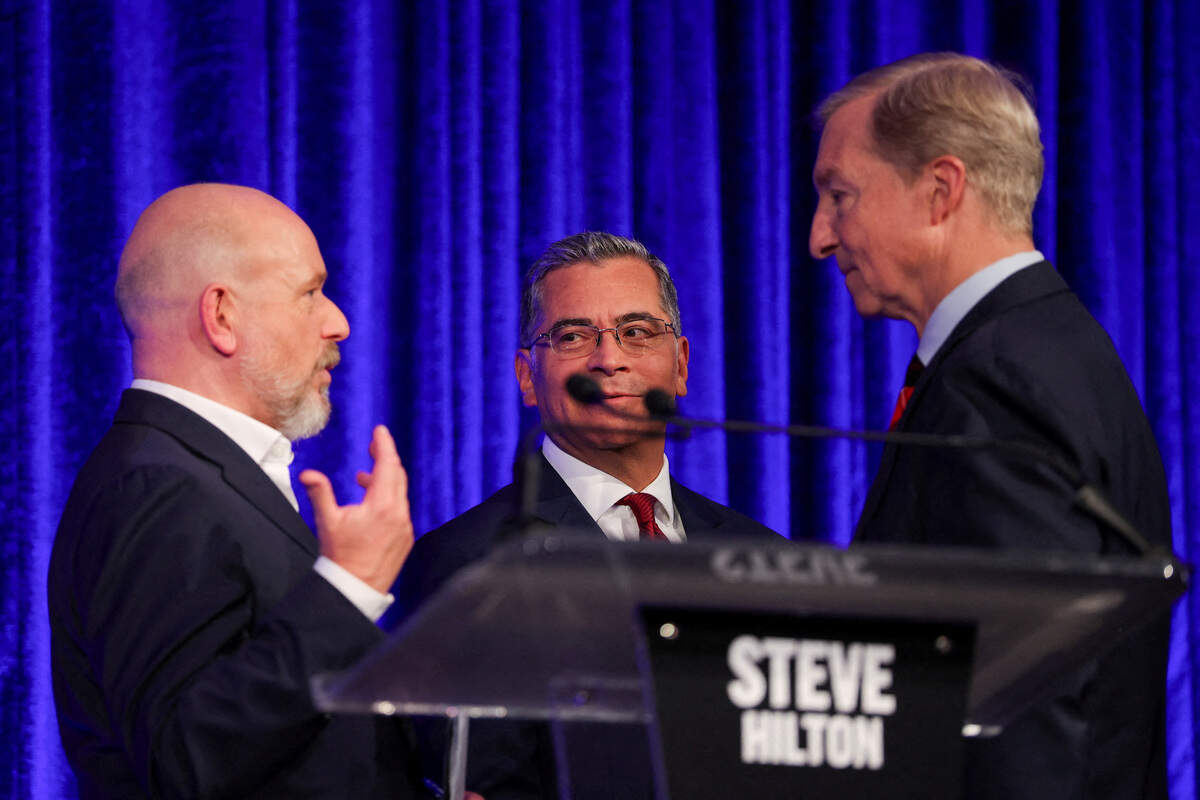 Republican Steve Hilton and Democrats Xavier Becerra and Tom Steyer talk at the end of a debate in the race for governor of California, in San Francisco on May 14, 2026.