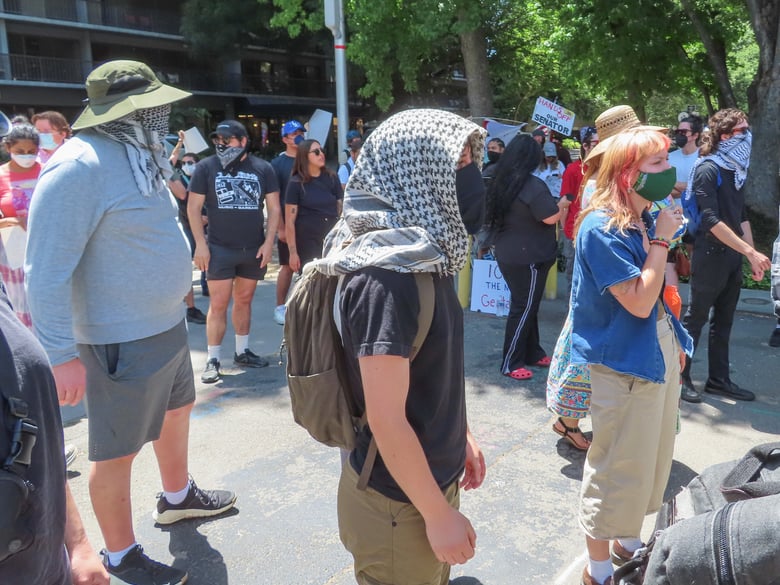 Protesters look at a van allegedly holding at least one immigrant detainee Thursday, June 12, 2025, outside of the John Moss Federal Building at 650 Capitol Mall in Sacramento. They blocked the exits to make sure the van couldn't leave. Protesters look at a van allegedly holding at least one immigrant detainee Thursday, June 12, 2025, outside of the John Moss Federal Building at 650 Capitol Mall in Sacramento. They blocked the exits to make sure the van couldn't leave.
