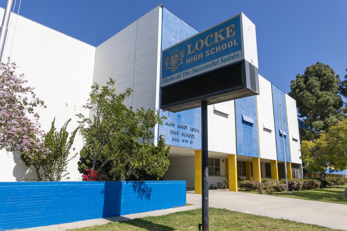  Exterior view of a building with a sign that says Locke High School