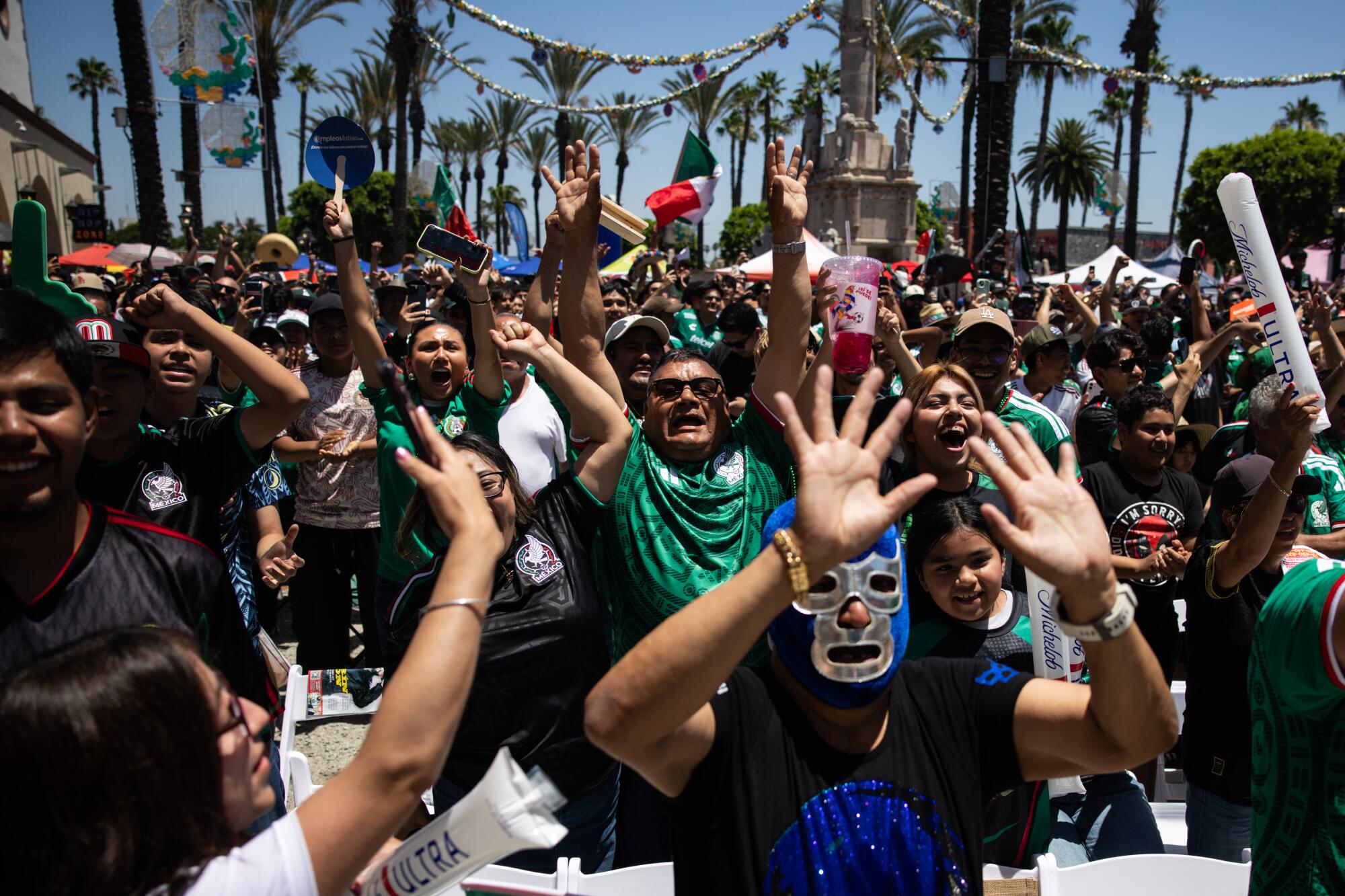 Mexico fans celebrate during a watch party at Plaza Mexico in Lynwood on Thursday.