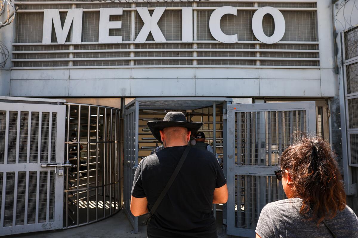 Alessandro Negrete, who lived most of his life in the U.S. undocumented, crosses into Mexico after deciding to leave.