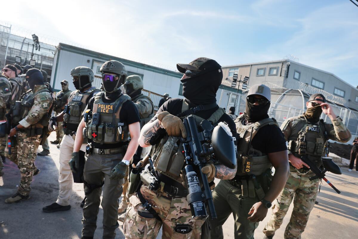 ICE agents confront protesters as they gather outside a New Jersey immigration center.