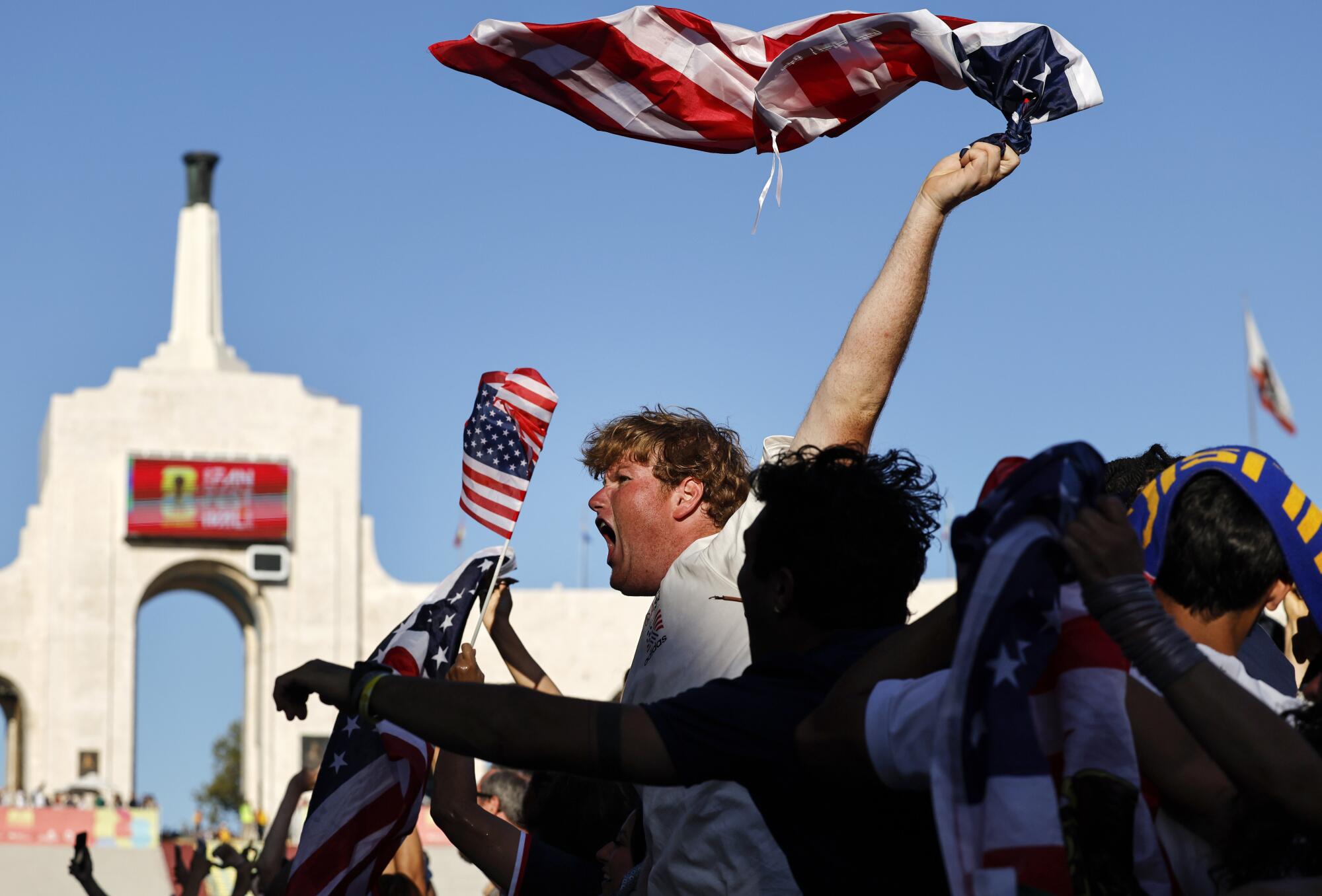 Fans cheer during a watch party at the Coliseum during the U.S. win over Paraguay Friday night.