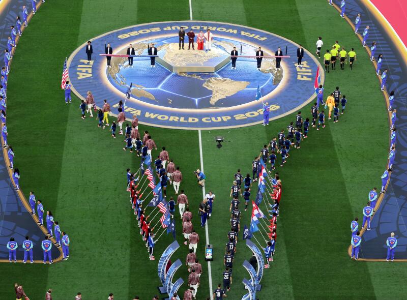  Teams United States, left, and Paraguay enter the pitch