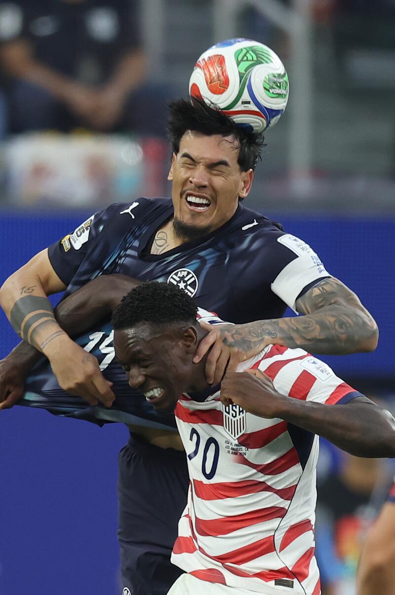 Paraguay midfielder Cristian Roldan heads the ball over U.S. striker Folarin Balogun during the second half.