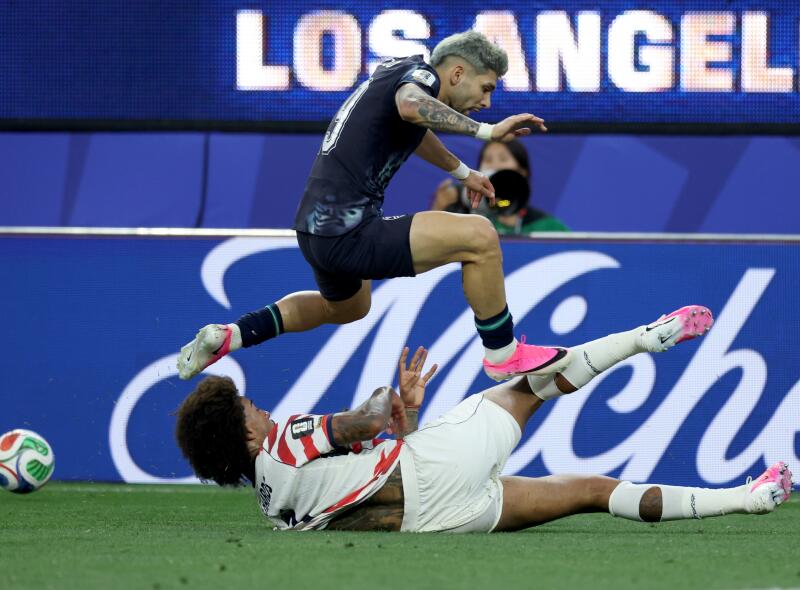 Paraguay forward Julio Enciso jumps over United States of America defender Chris Richards.