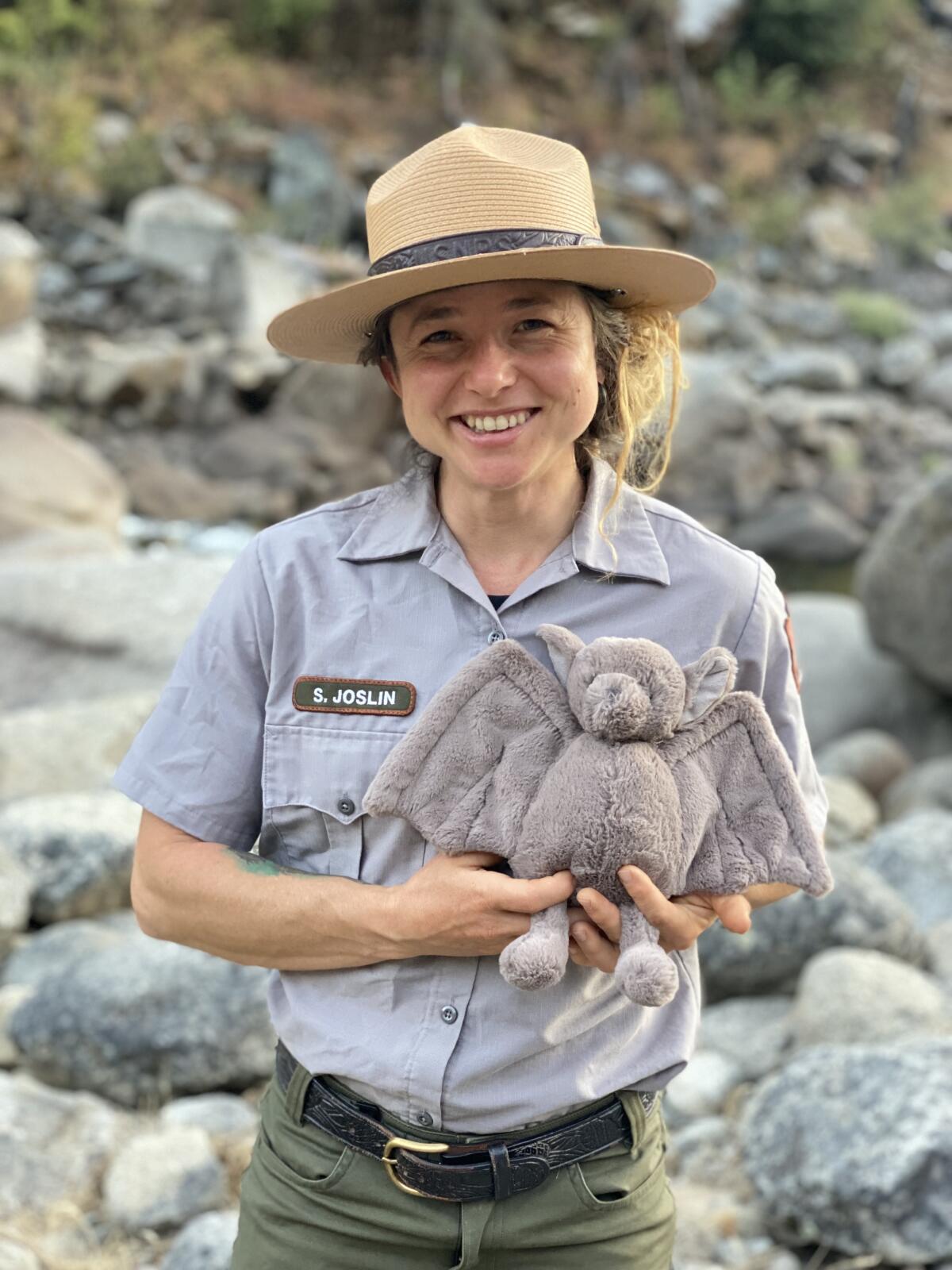 Shannon Joslin holds a bat-shaped toy