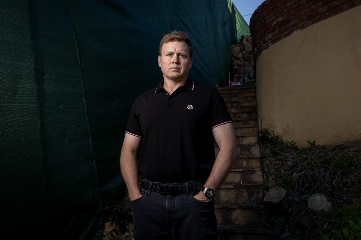 Spencer Pratt poses for a portrait where his home once stood.