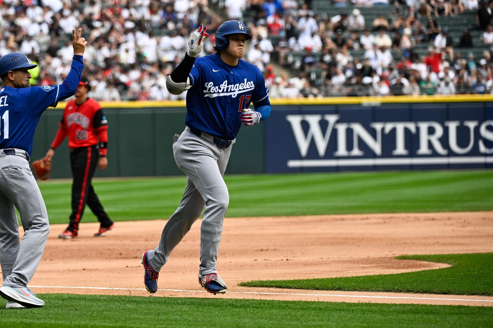 Dodgers star Shohei Ohtani runs the bases after hitting a home run against the White Sox on Saturday.