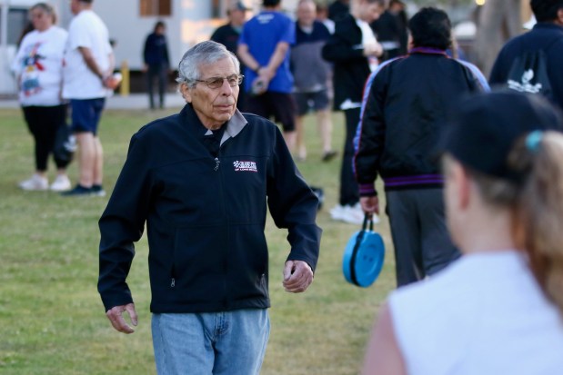 Grand Prix Association president and CEO Jim Michaelian walks through the crowd on Sunday, Apr. 6, 2025, prior the Grand Prix Foundation of Long Beach 5K downtown. (Photo by Howard Freshman, Contributing Photographer)