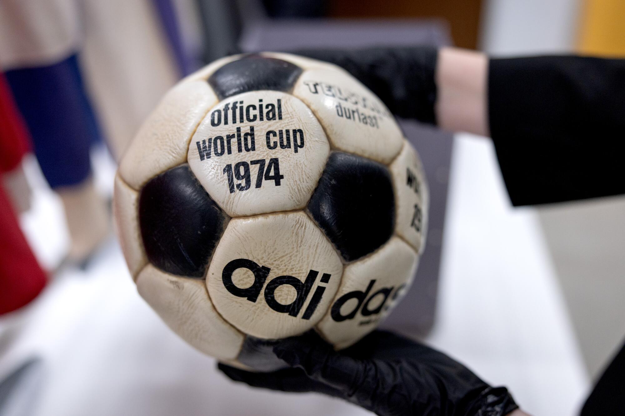 A soccer ball from the 1974 World Cup is displayed at an exhibit called "The Beautiful Game … The Untold Story."