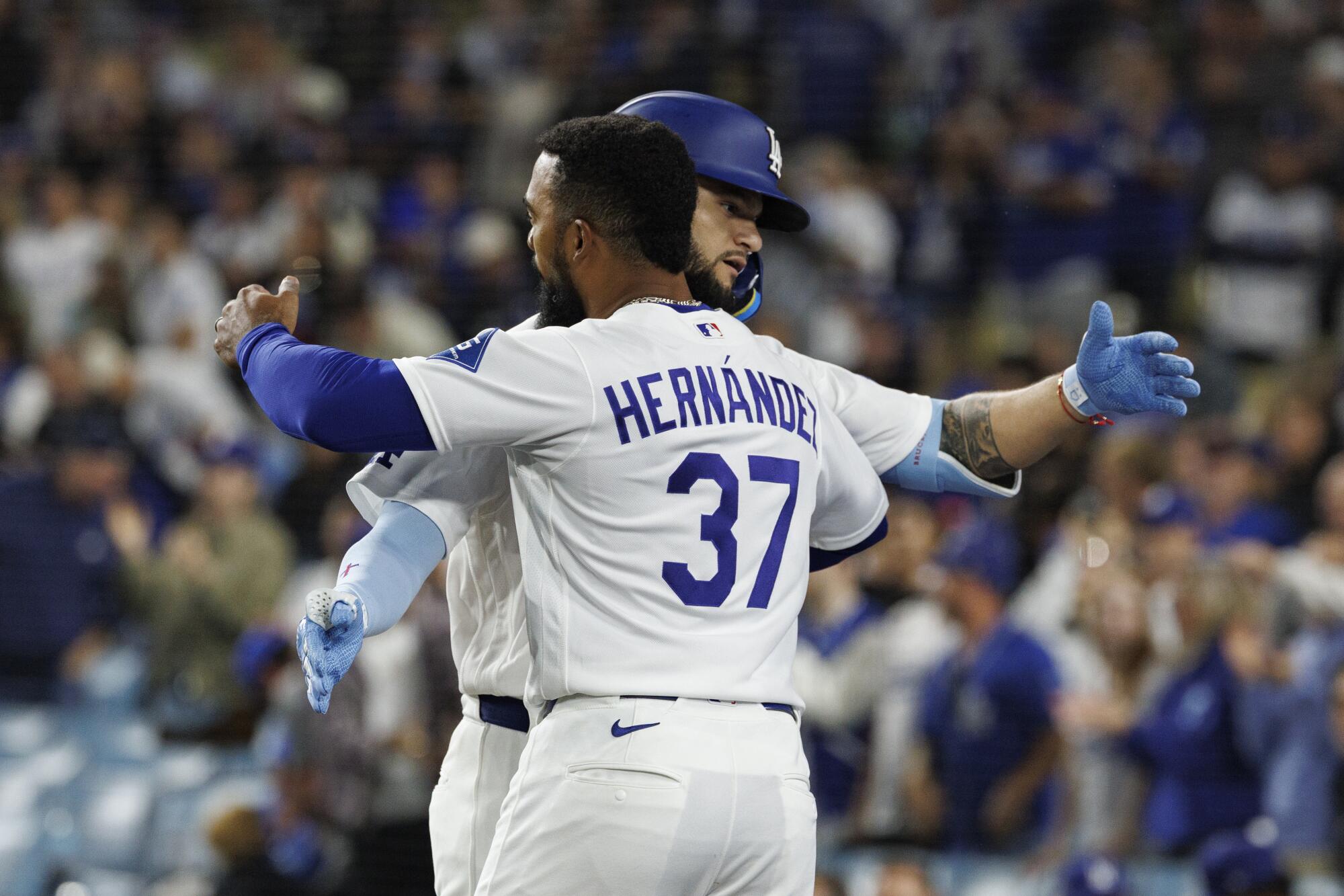 The Dodgers' Andy Pages gets a hug from Teoscar Hernández after hitting a two-run homer on April 10.