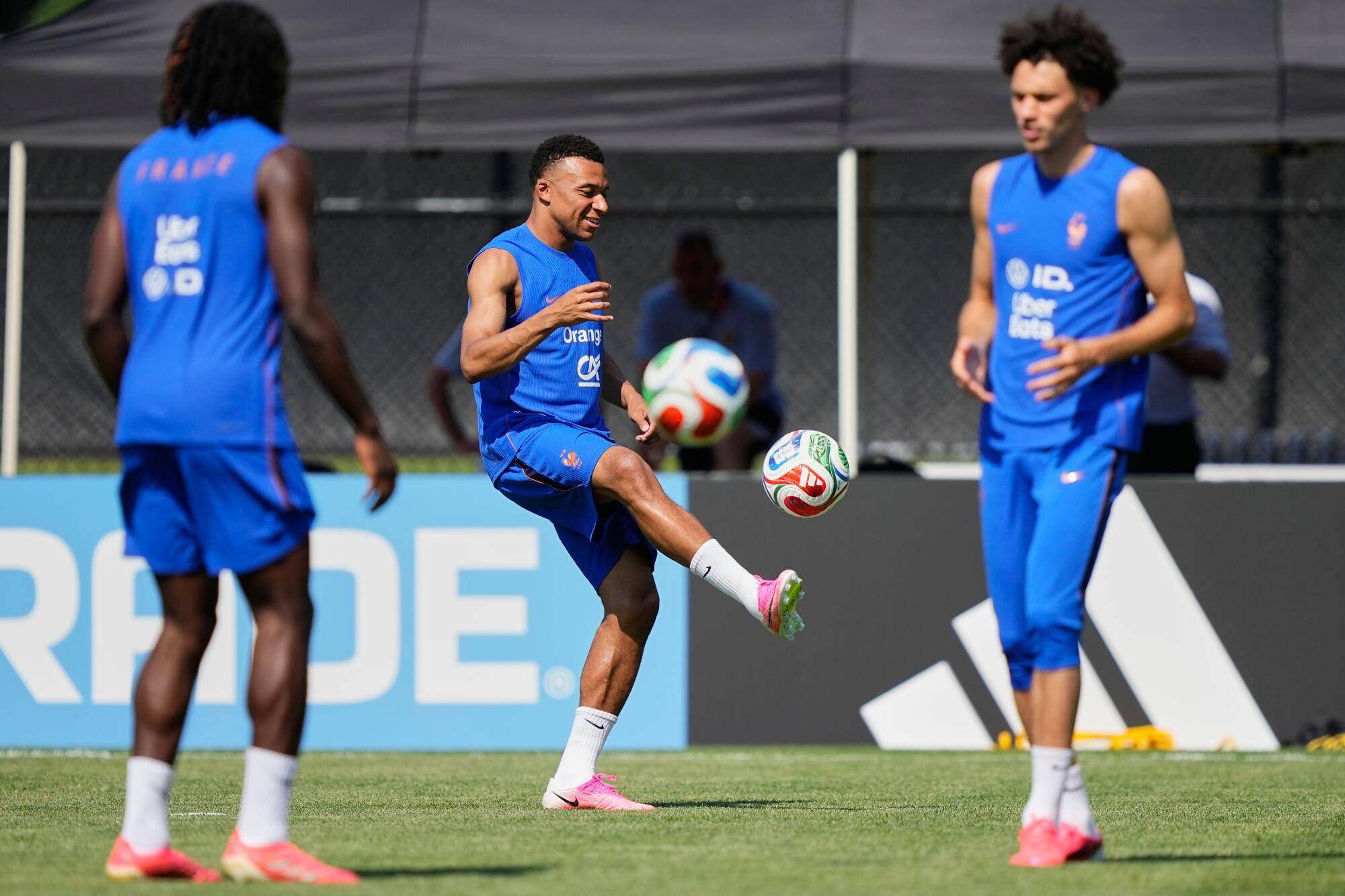 France's Kylian Mbappe works out with teammates in Waltham, Mass., on Friday.