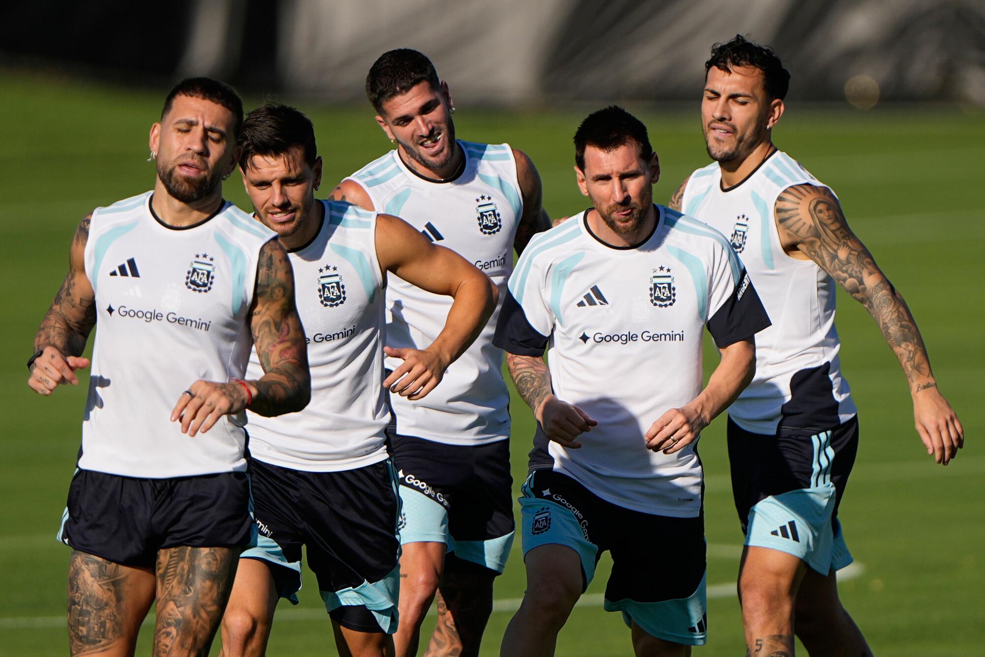 Argentina's Lionel Messi, fourth from left, practices with teammates in Kansas City, Kan., on Thursday.