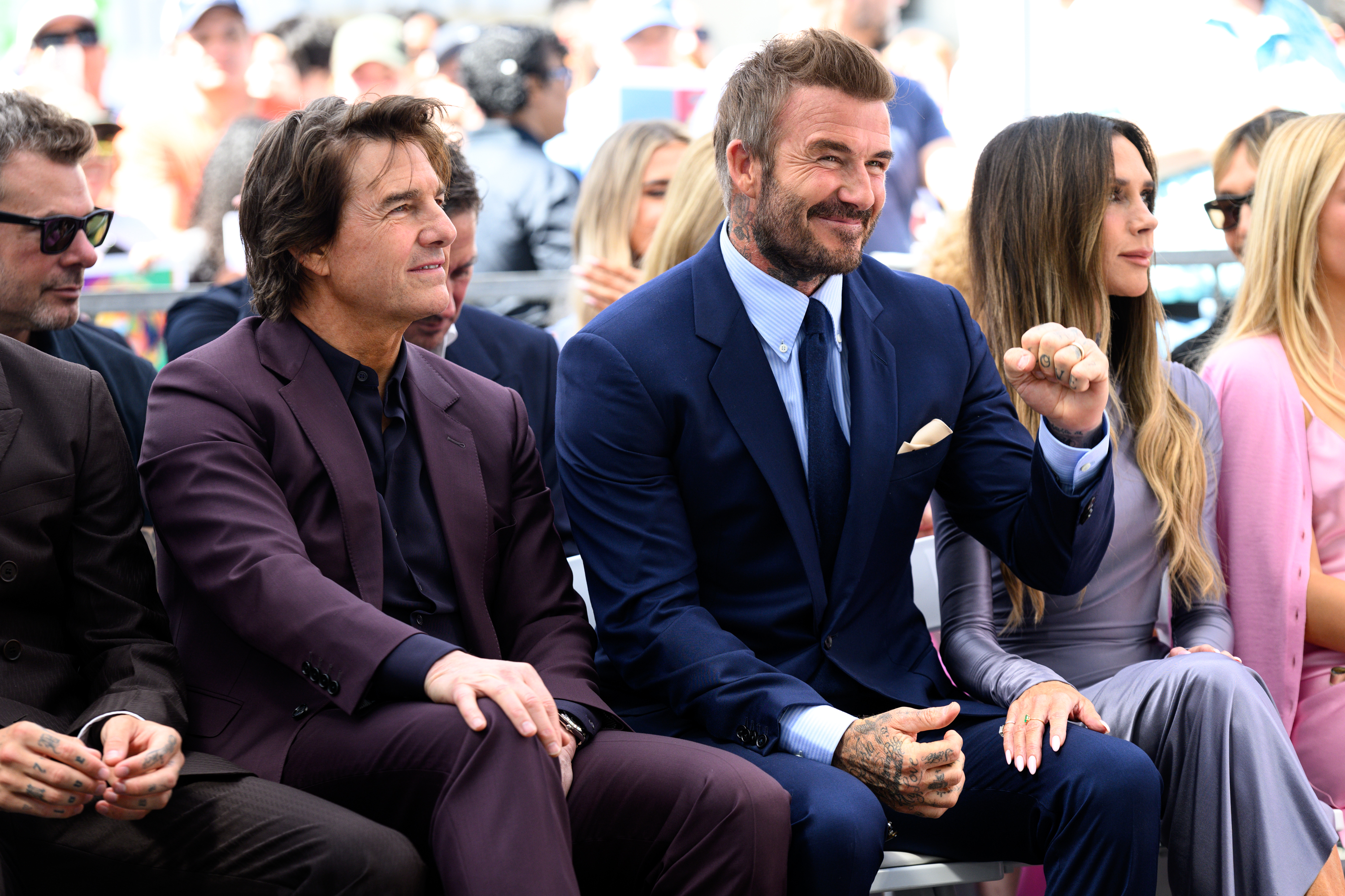 Tom Cruise sits with David Beckham at his Hollywood Walk...