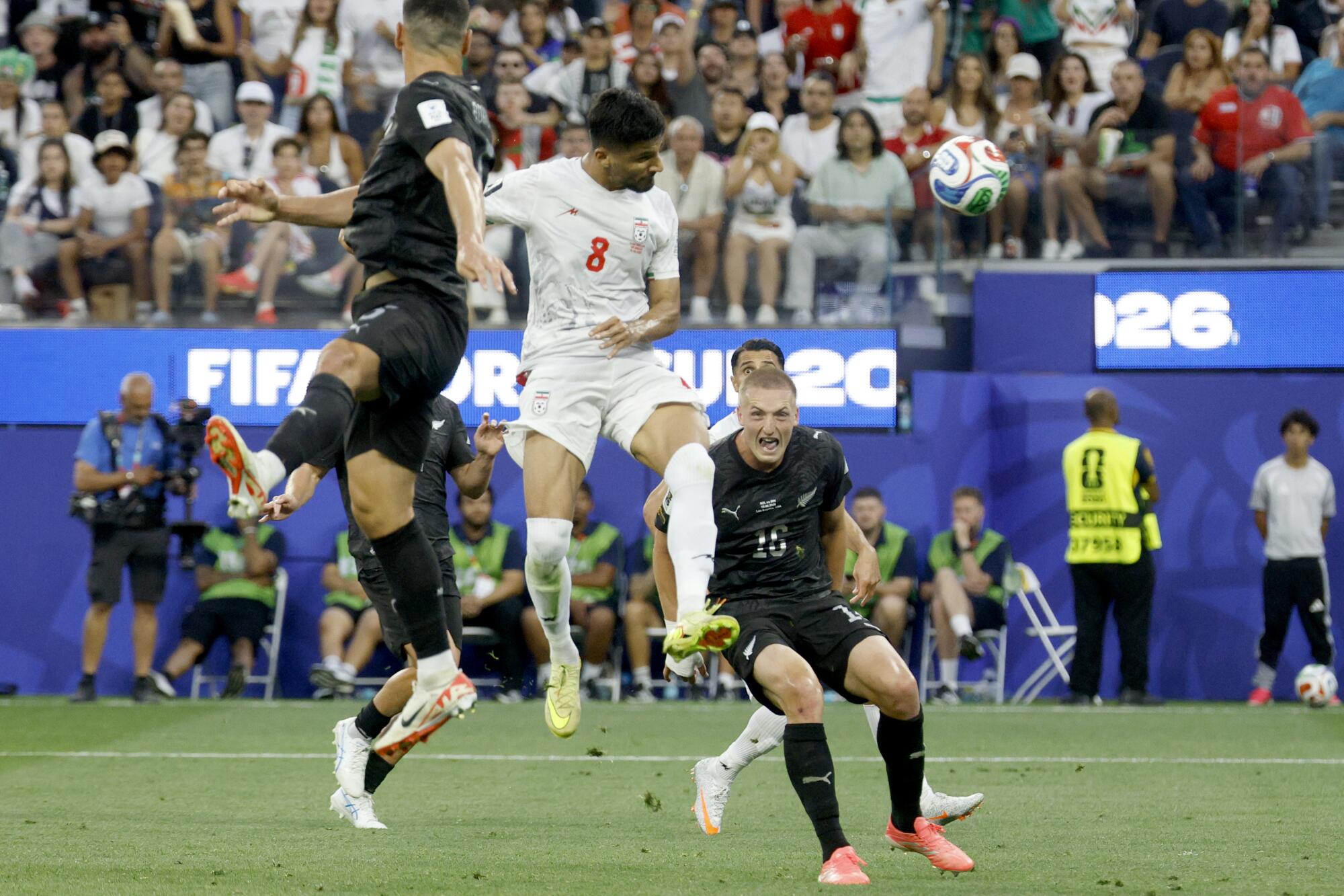 Iran forward Mohammad Mohebi (8) heads the ball for a goal during the second half.