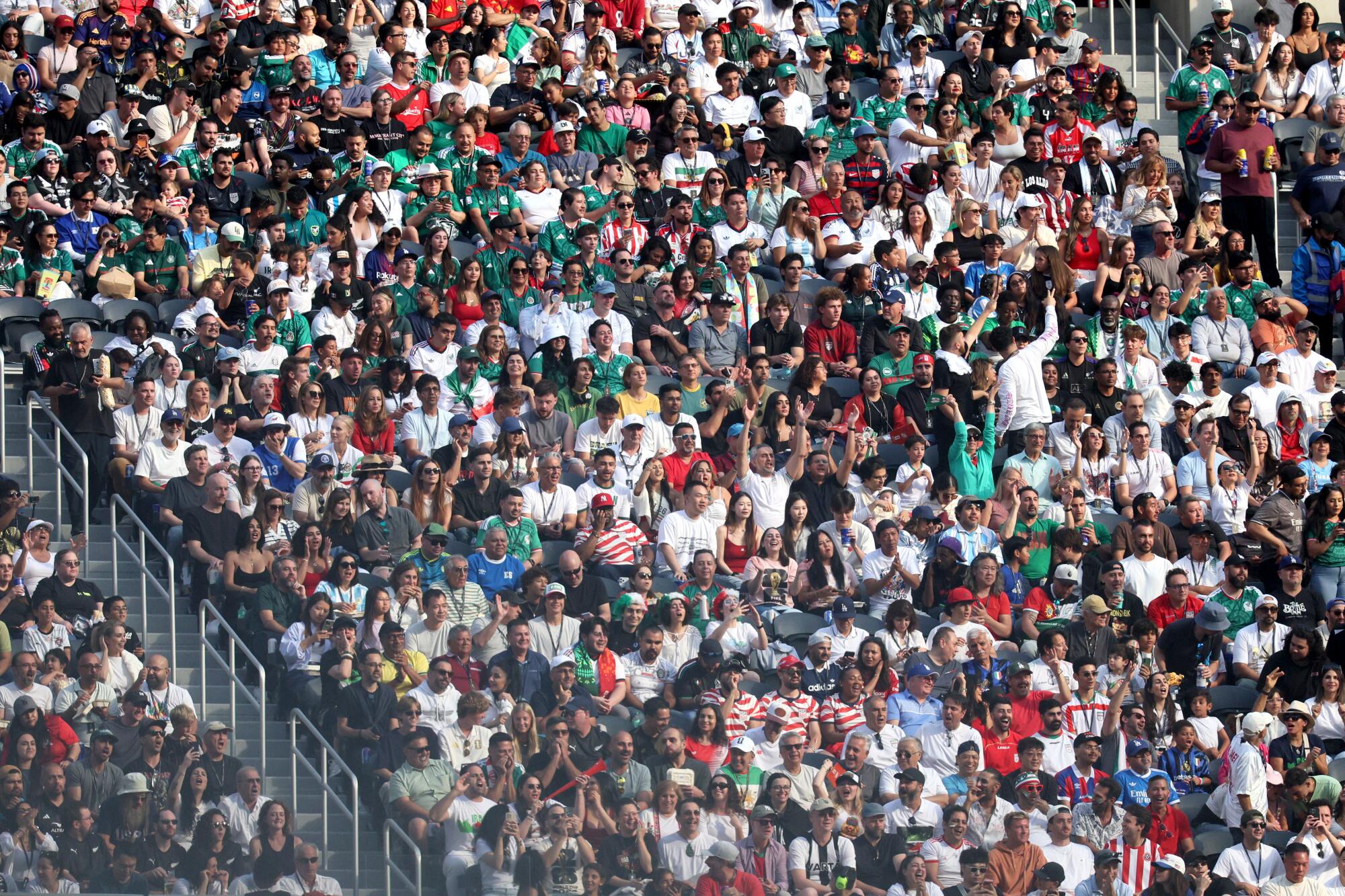 Fans watch the World Cup group stage match between Iran and New Zealand at SoFi Stadium on Monday.