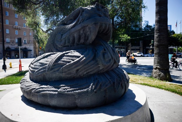 People past the ride past the "Plumed Serpent" by Robert Graham on South Market Street during Viva CalleSJ's "Greetings from San Jose" in downtown San Jose, Calif., on Sunday, June 14, 2026. (Nhat V. Meyer/Bay Area News Group)