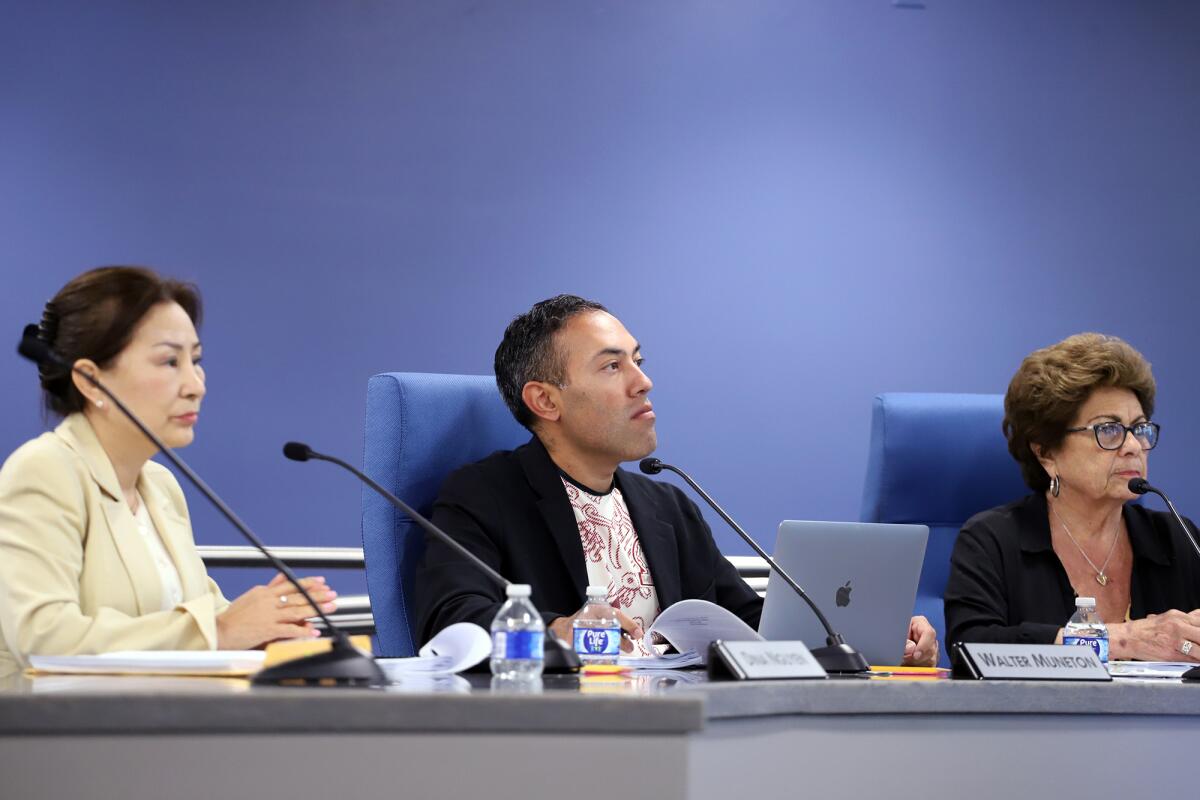 Trustee Walter Muñeton, center, helped spearhead the renaming effort.