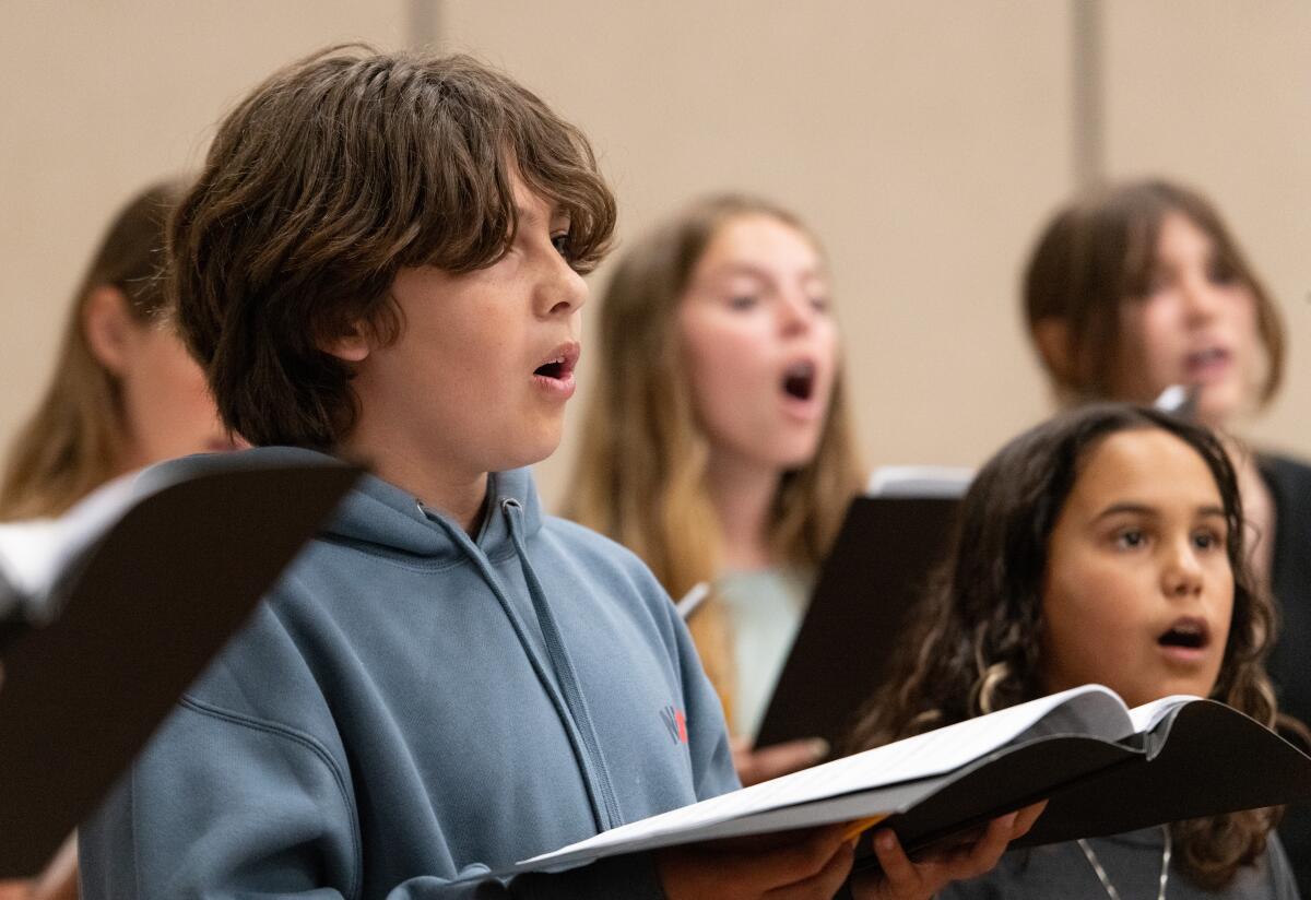 Youth join their voices together as part of the Voices in Unity: America 250 Choir during rehearsal.