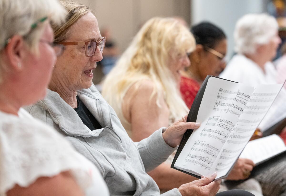 Members of the Voices in Unity: America 250 Choir rehearse at the Costa Mesa Senior Center on Tuesday.