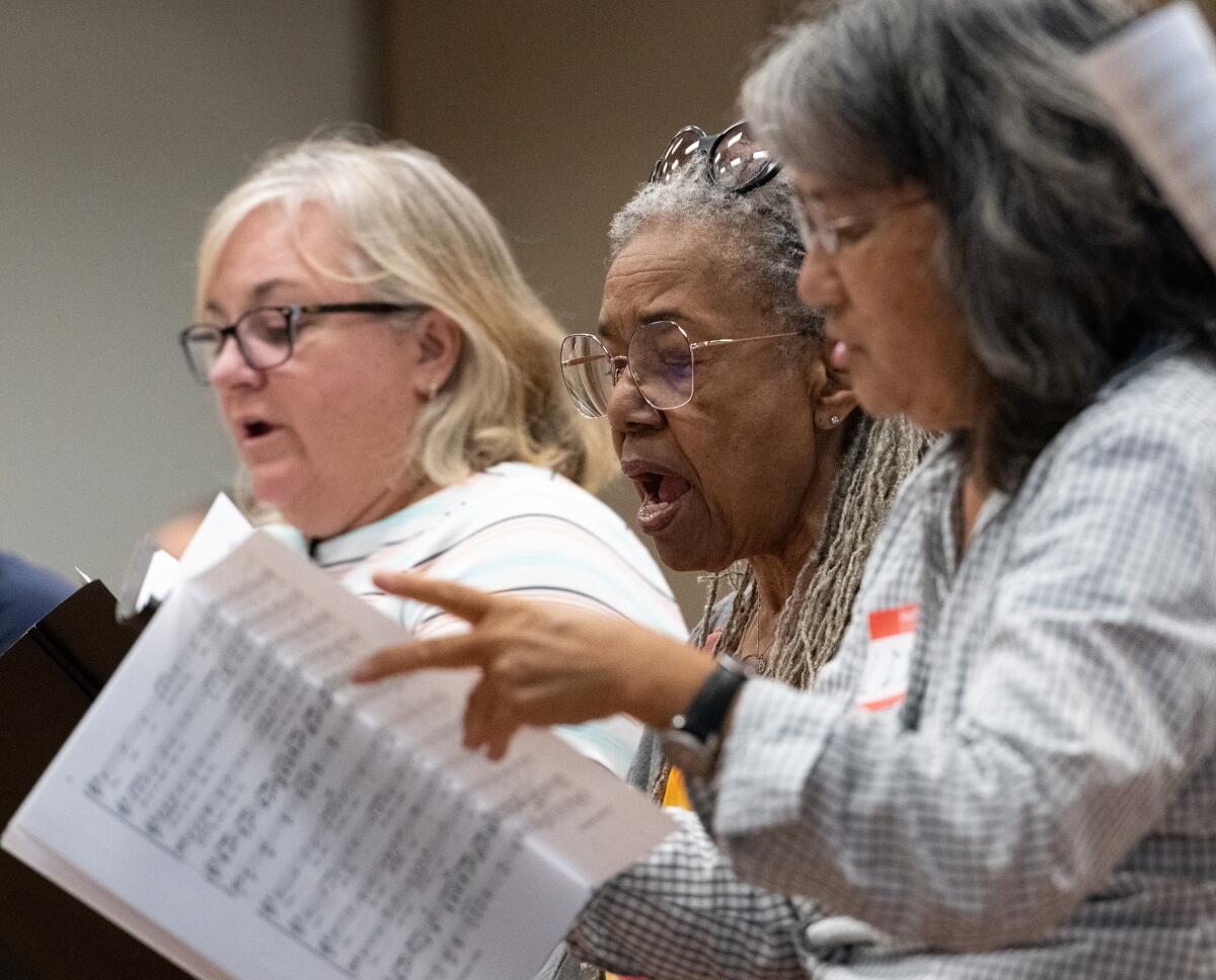 Mary Watson-Bruce, center, joins the Voices in Unity: America 250 Choir for rehearsal at the Costa Mesa Senior Center.