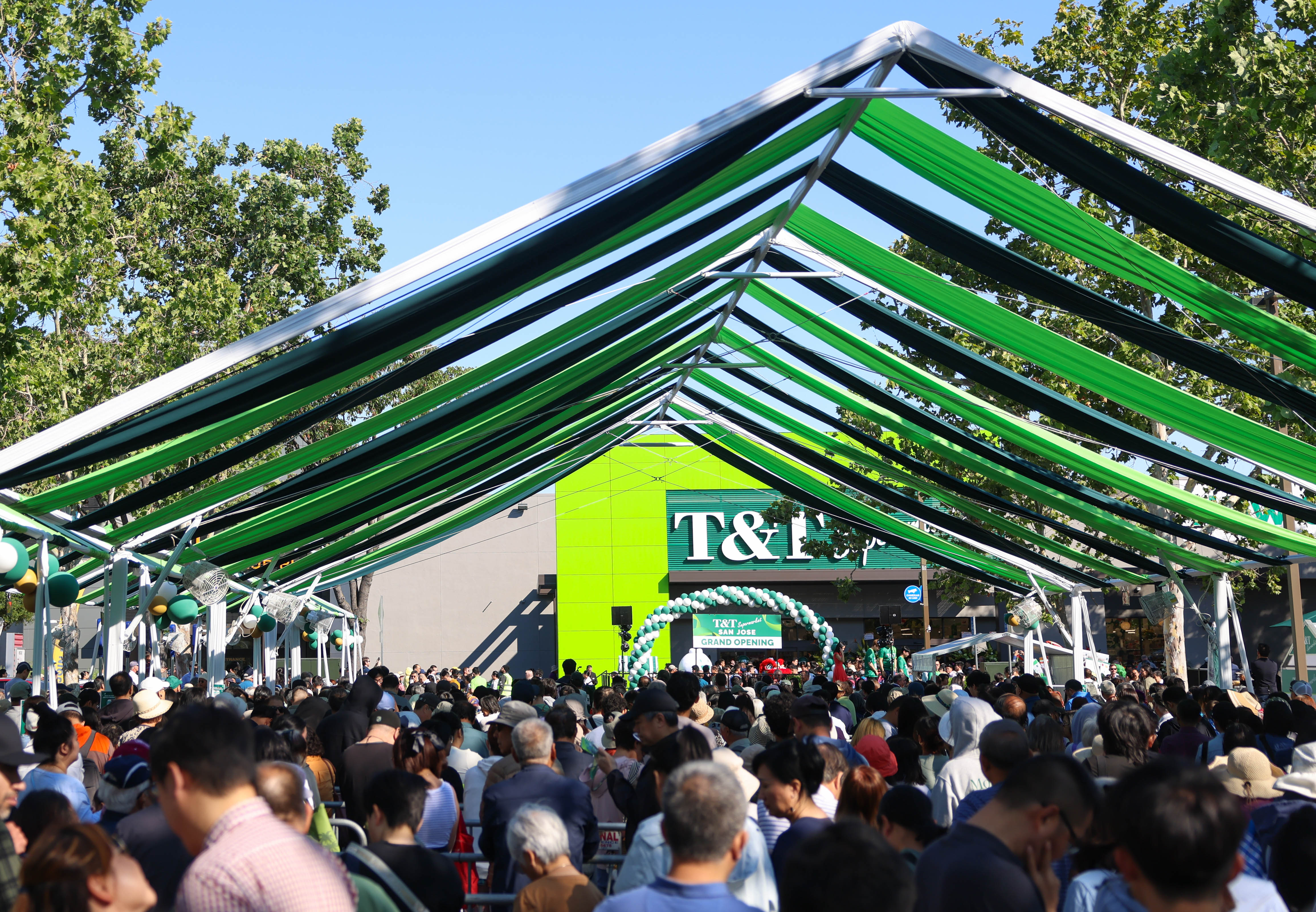 People line up to go inside T&T Market at Westgate...