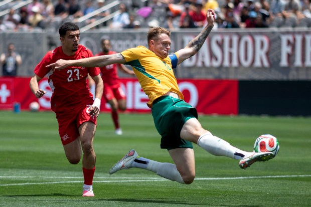 Australia's captain, Harry Souttar (19) strecthes for a mid-air defensive clearance during Saturday's International Friendly against Switzerland. The teams played at Snapdragon Stadium in San Diego, CA, in preparation for the 2026 FIFA World Cup. (Xavier Hernandez for the UT)
