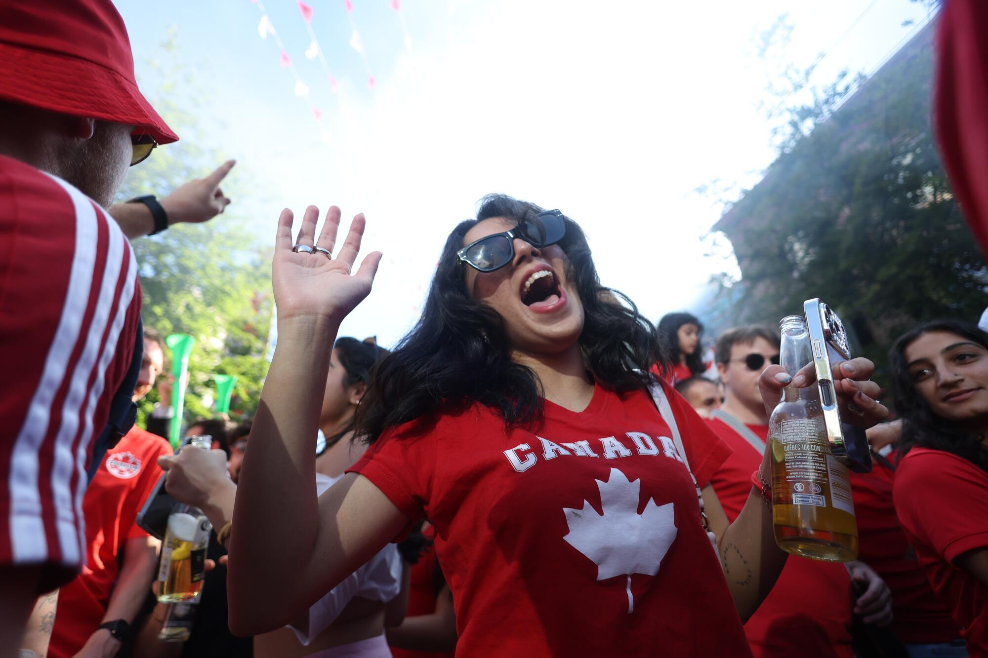 Canada fans celebrate after a 6-0 win over Qatar at the World Cup on Thursday.