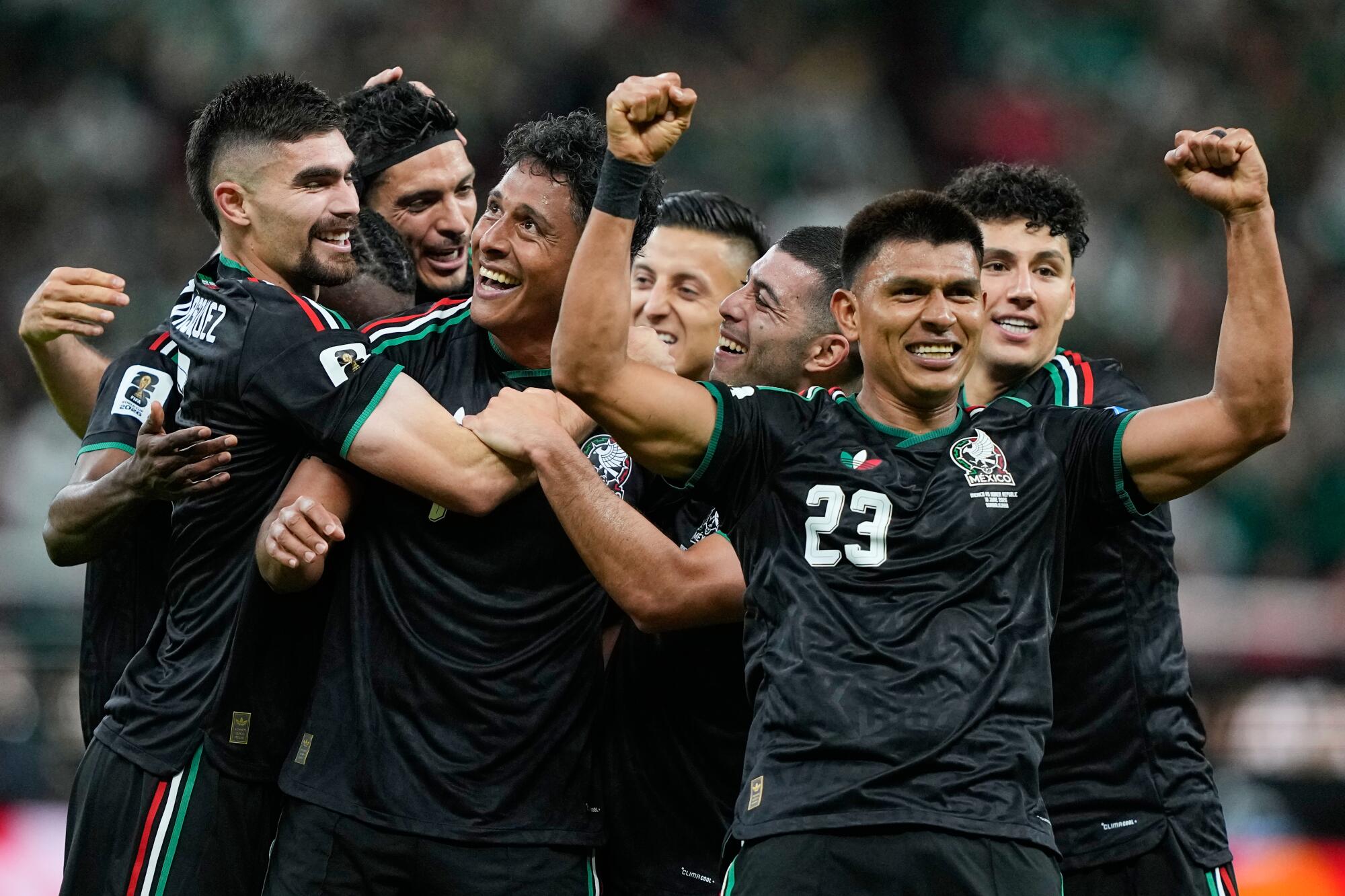 Mexico's Luis Romo celebrates with his teammates after scoring during a match against South Korea at Guadalajara Stadium
