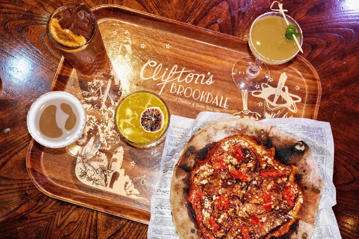 Pizza and cocktails on a Clifton's branded vintage tray