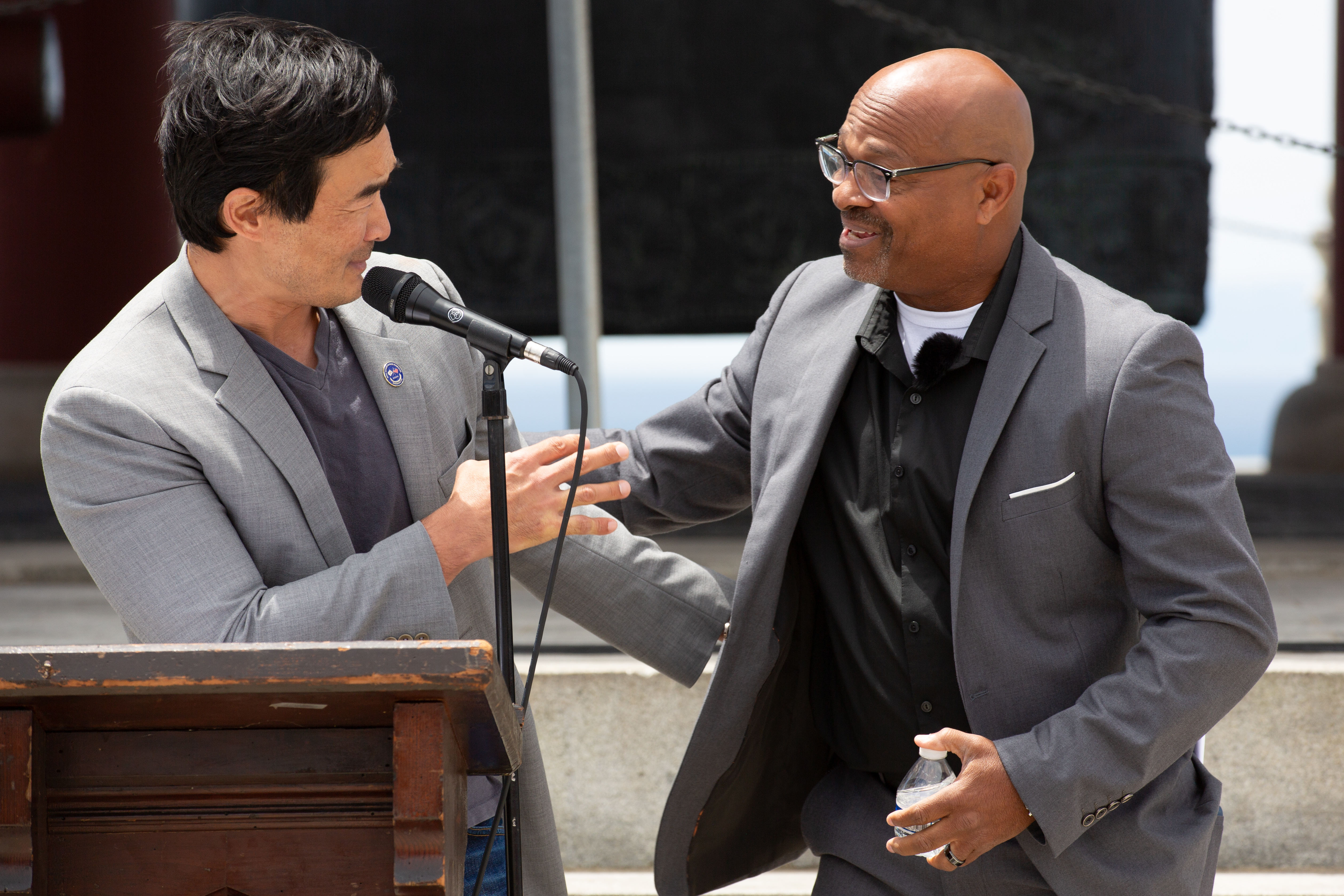 Filmmakers Terrence Williams, left, and Arnold Chun greet each other...