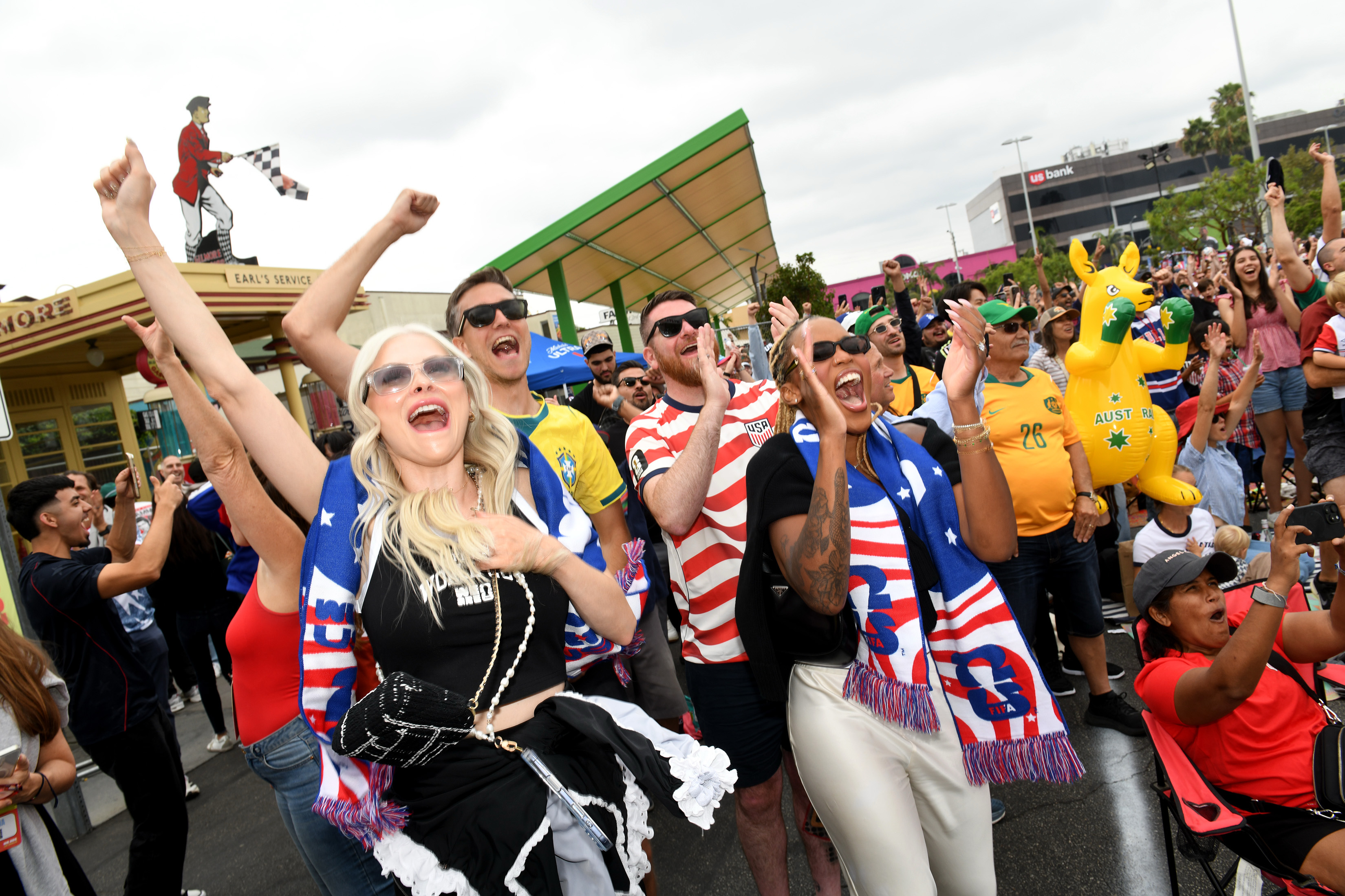 Jennifer Panosso, left, and Sabrina Bias cheer an American goal...