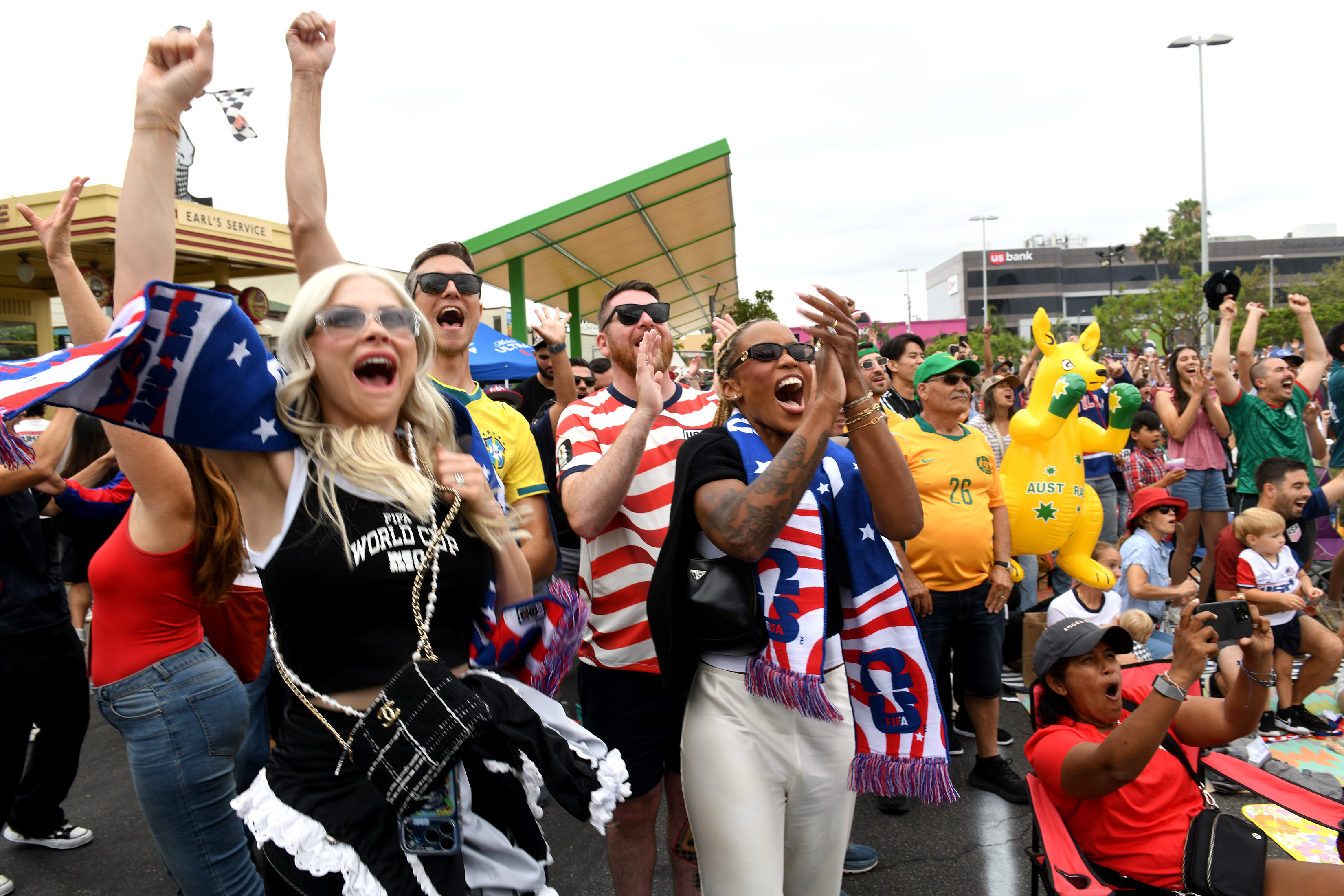Jennifer Panosso, left, and Sabrina Bias cheer an American goal...
