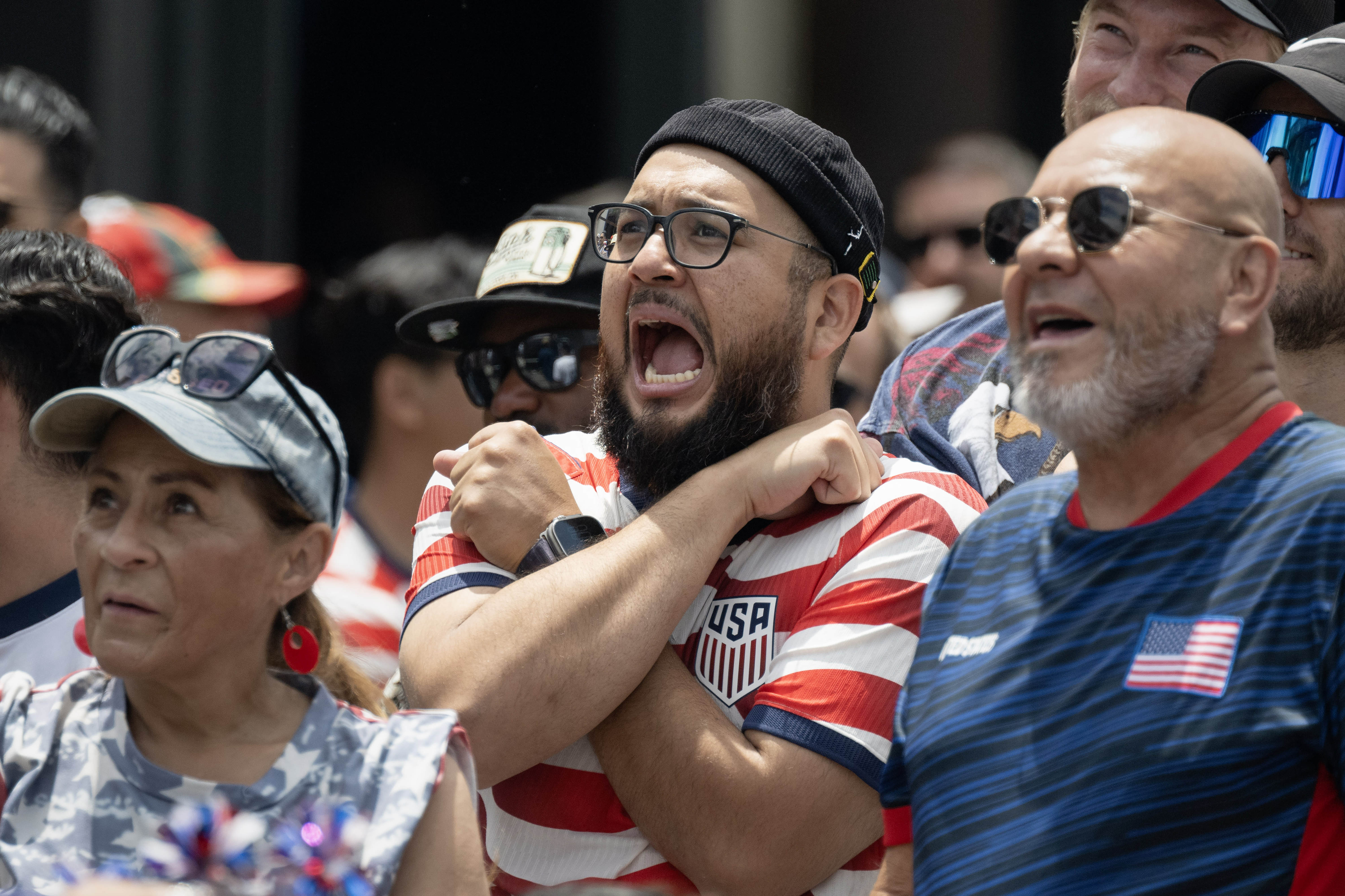 U.S.A. fans react to a serious foul resulting in a...