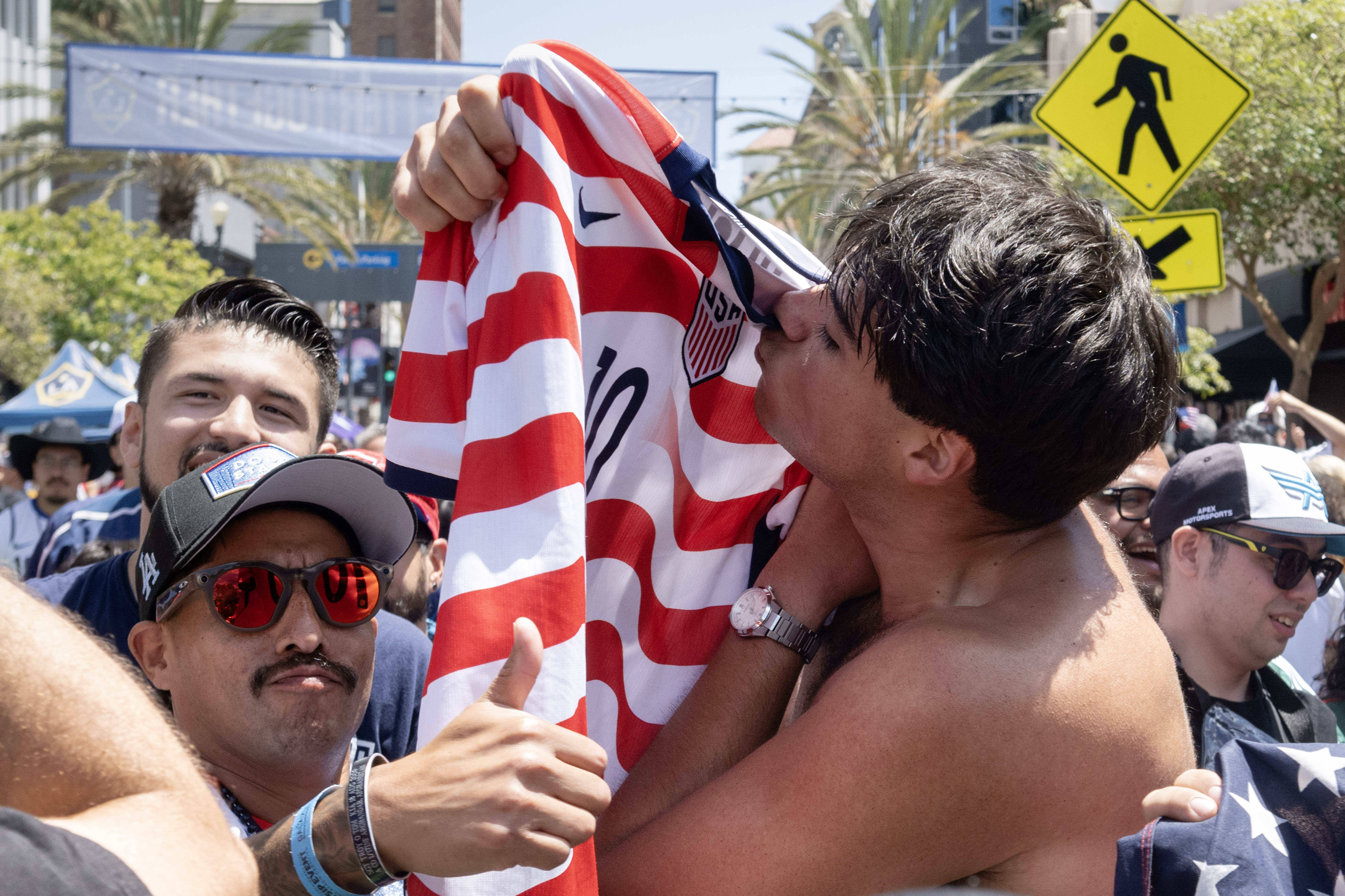 Brandon Suiter kisses his U.S.A. jersey following their win against...