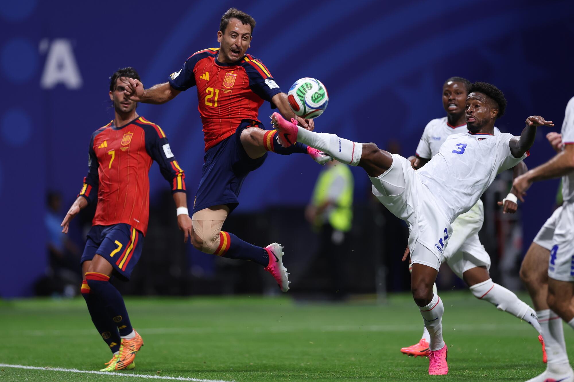Spain's Mikel Oyarzabal, top, challenges for the ball during a draw with Cape Verde on June 15.