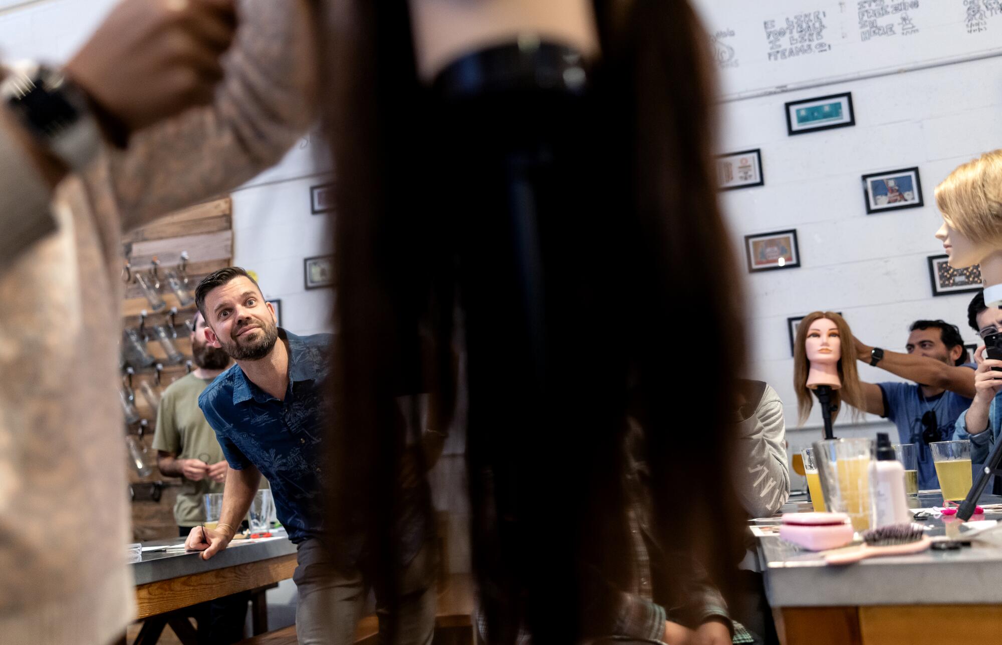 A group of dads from Santa Barbara Dads Group participate in a 'Pints & Ponytails' event.