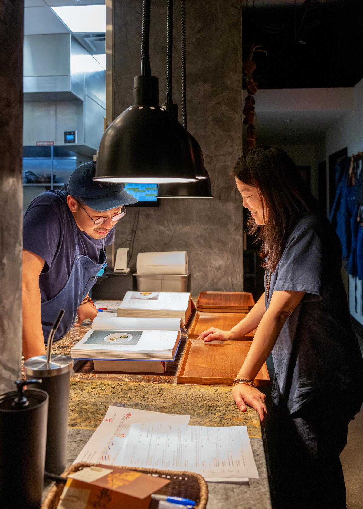 Chef Kwang Uh, left, and his wife Mina Park, right