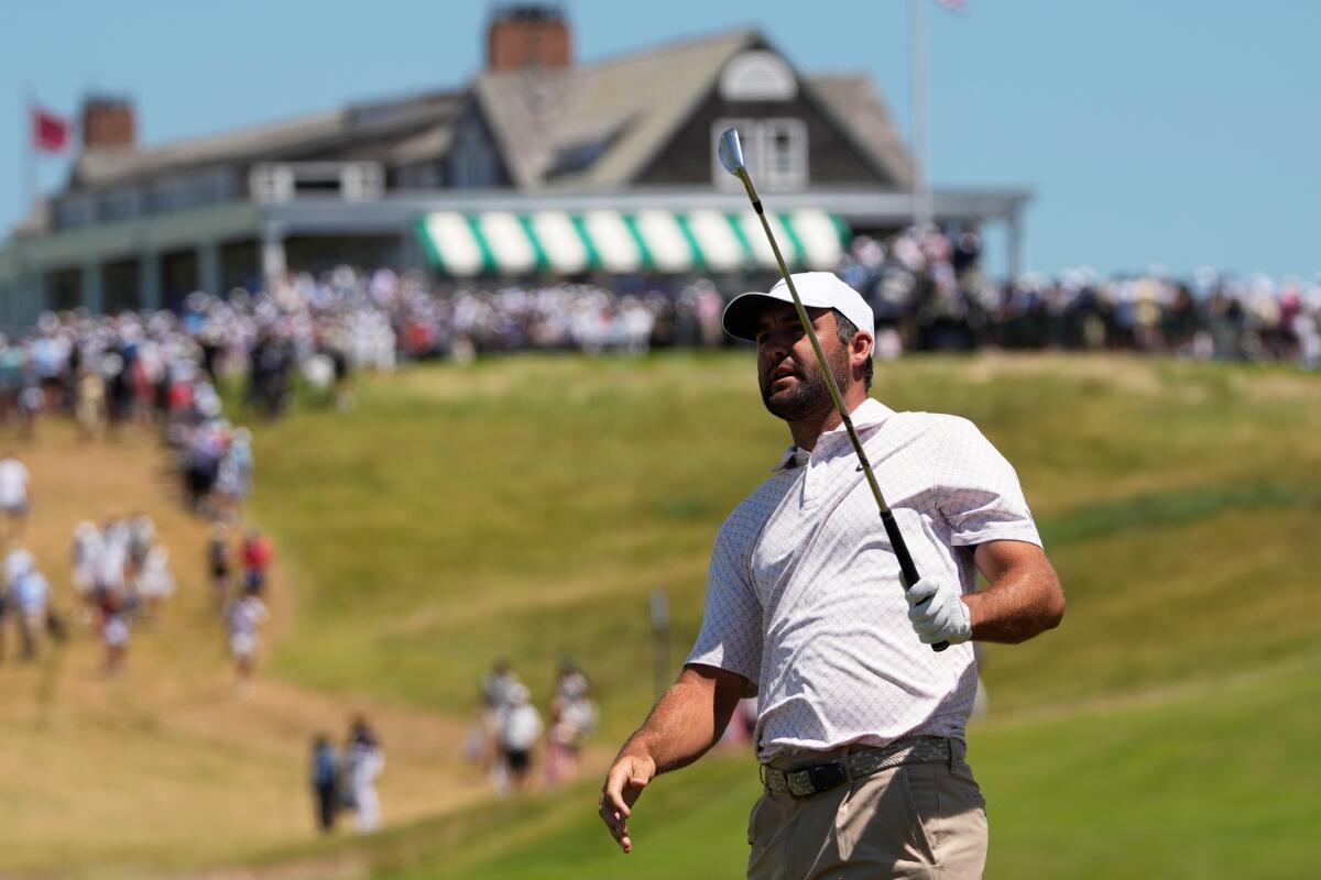 Scottie Scheffler watches his shot on the first hole during the third round of the U.S. Open on Saturday.