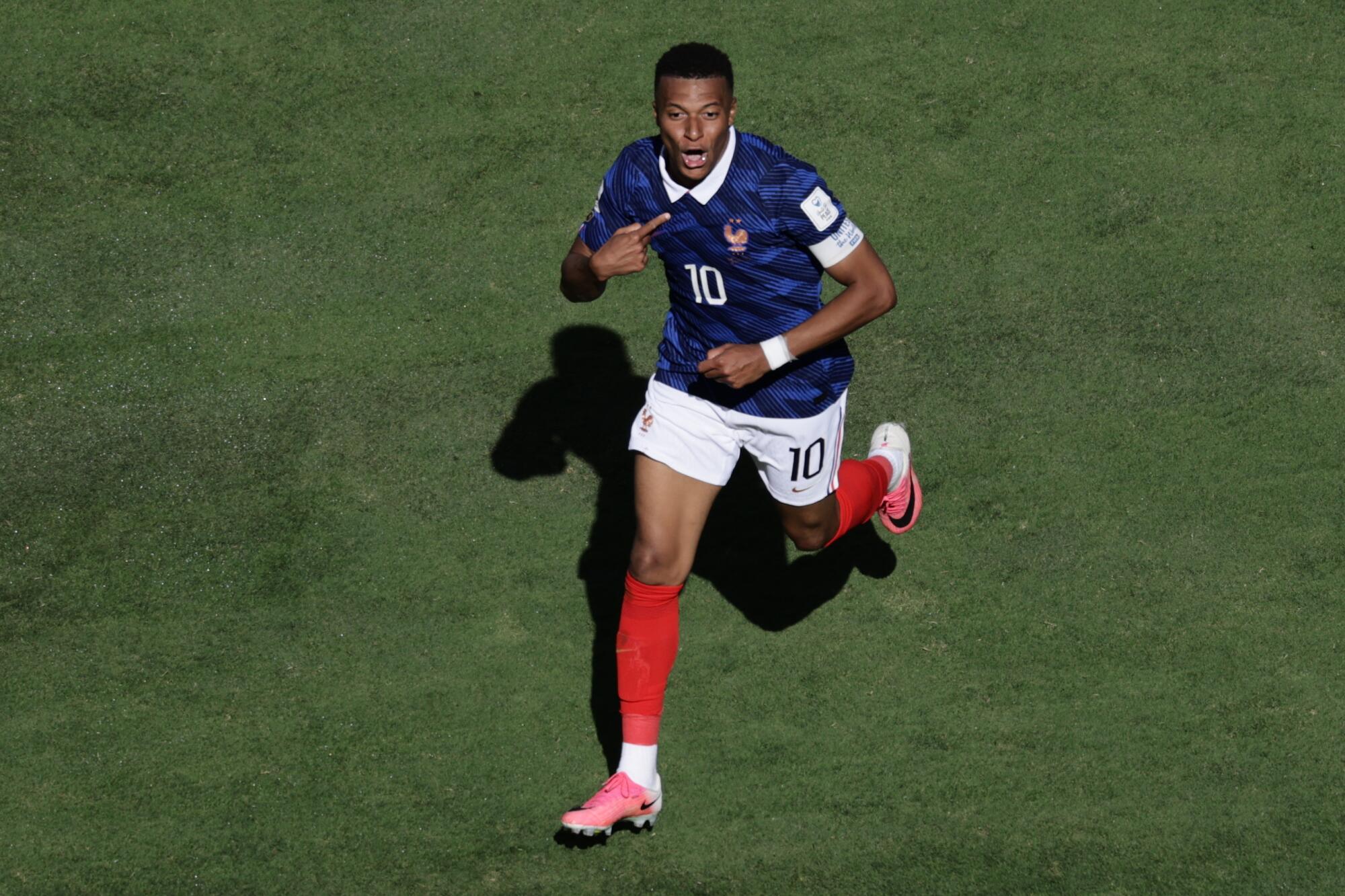 France's Kylian Mbappé celebrates after scoring against Senegal on June 16.