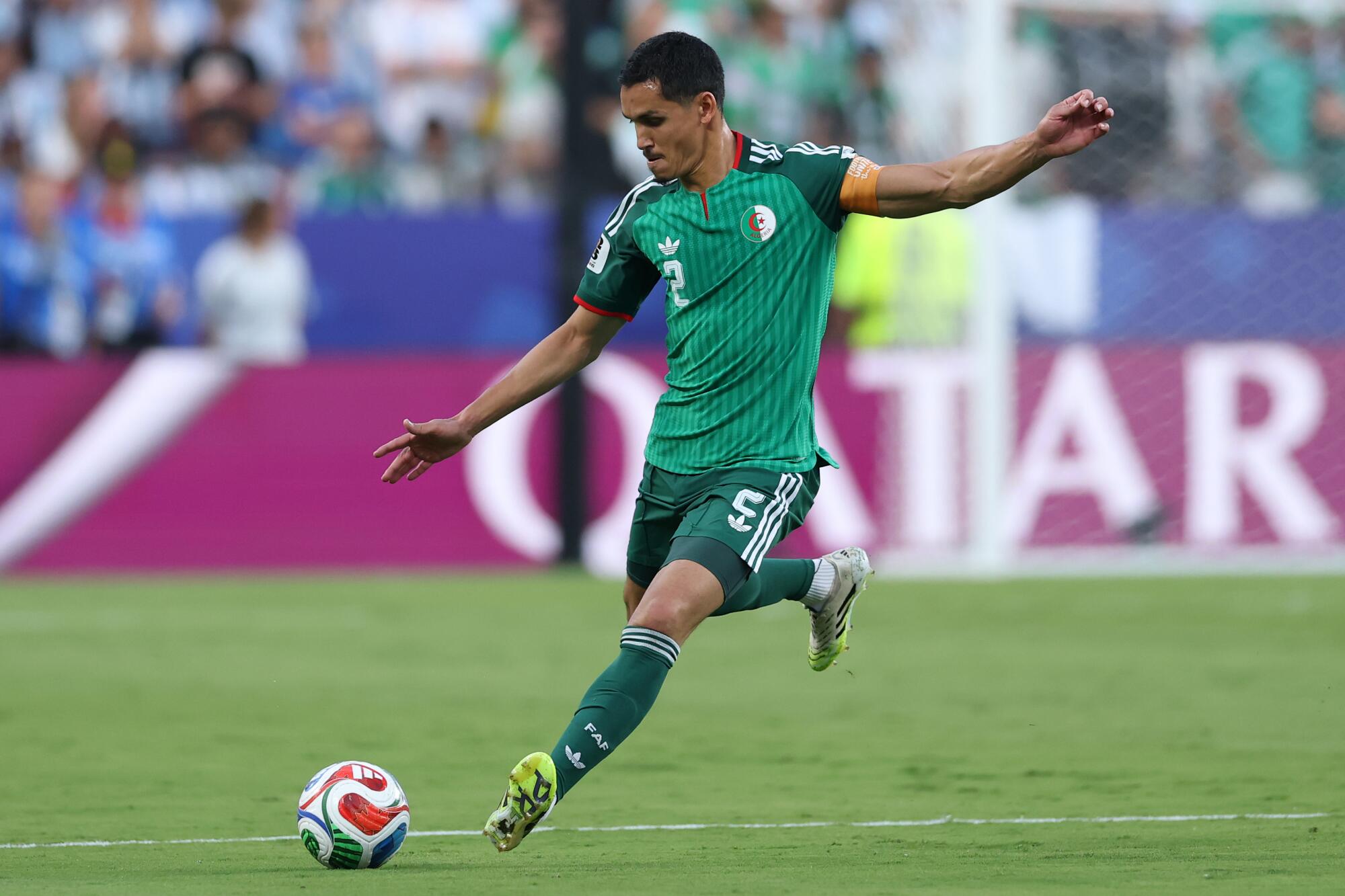 Algeria's Zineddine Belaïd kicks the ball during a World Cup loss to Argentina on June 16.