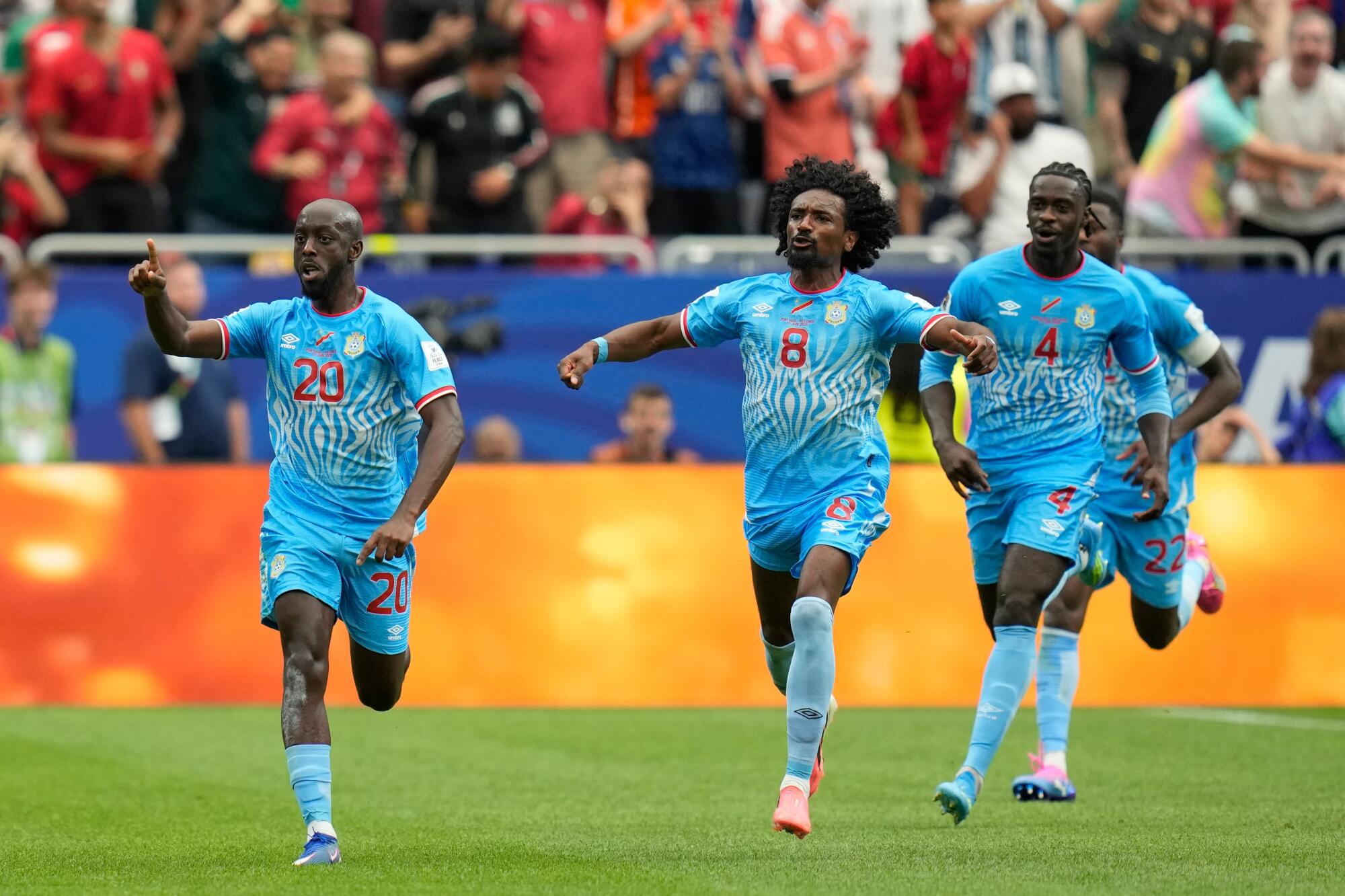 Yoane Wissa, left, celebrates with teammates