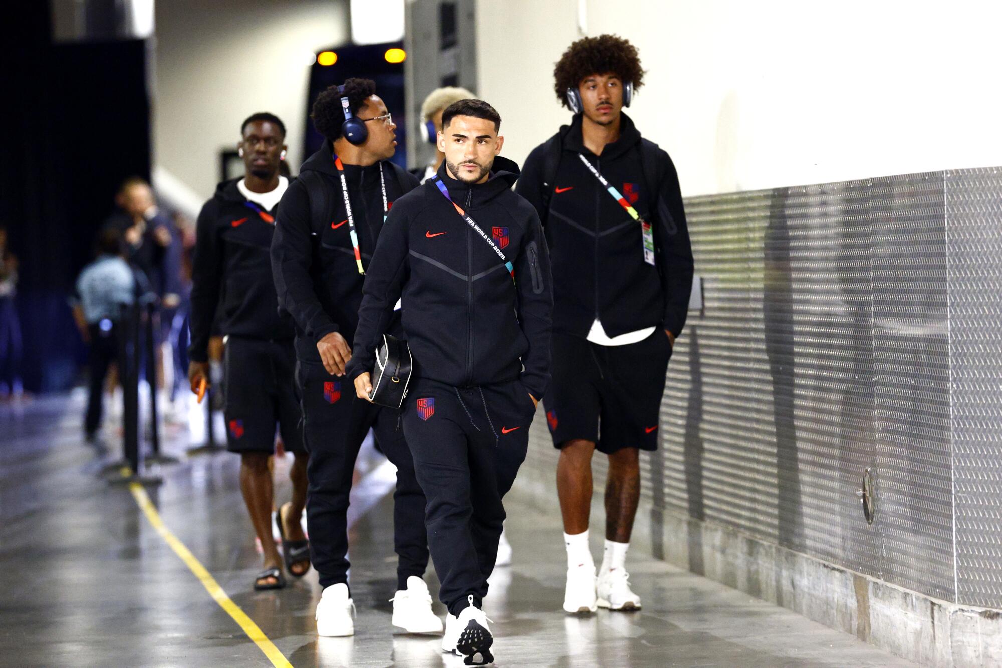 U.S. men's national team player Cristian Roldan, center, and his teammates arrive at SoFi Stadium before a World Cup match.