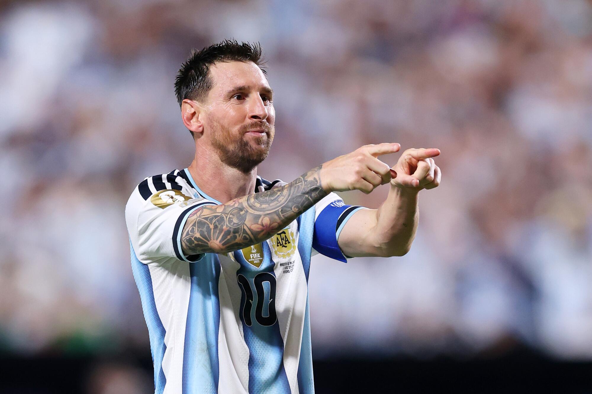 Argentina star Lionel Messi celebrates after scoring his third goal against Algeria in the World Cup on June 16.