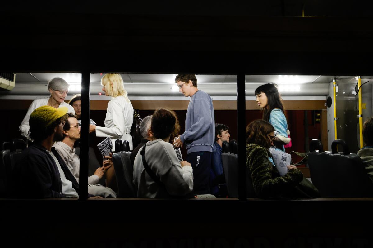 Passengers board a bus.