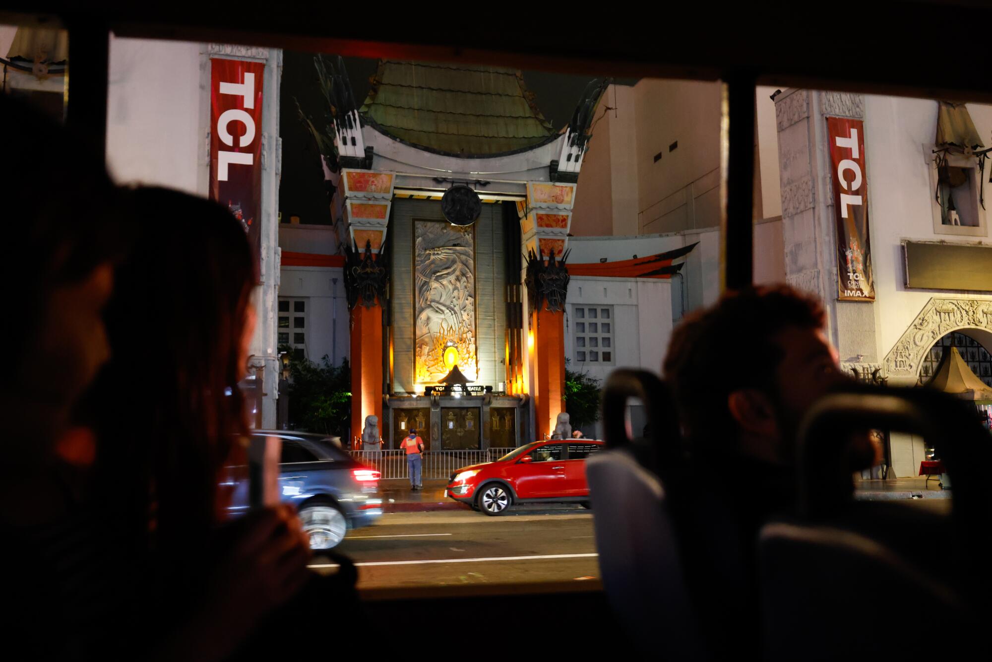 A bus passes the TCL Chinese Theatre.
