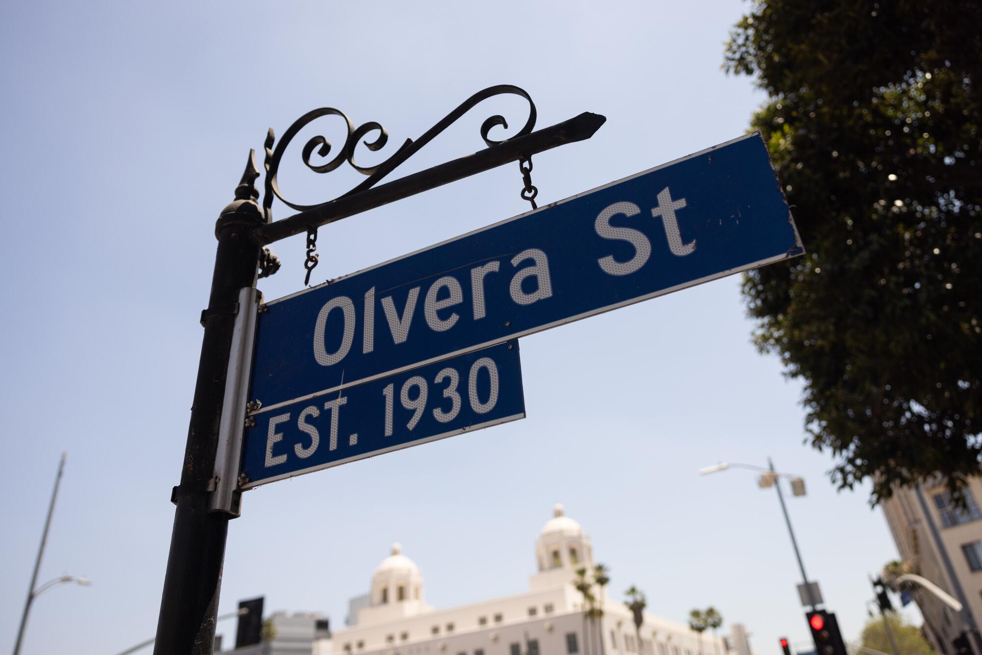 A street sign at the entrance of Olvera Street.